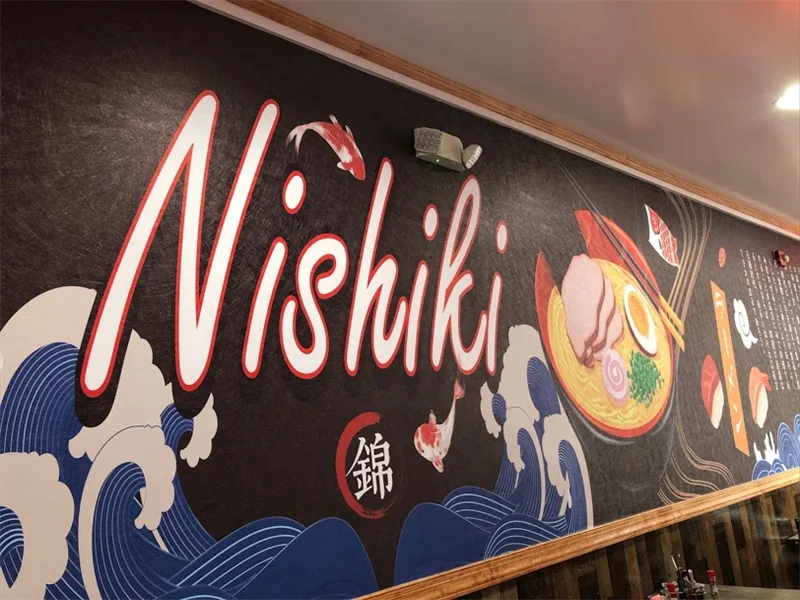 Vibrant mural featuring Japanese ramen and koi fish at Nishiki restaurant