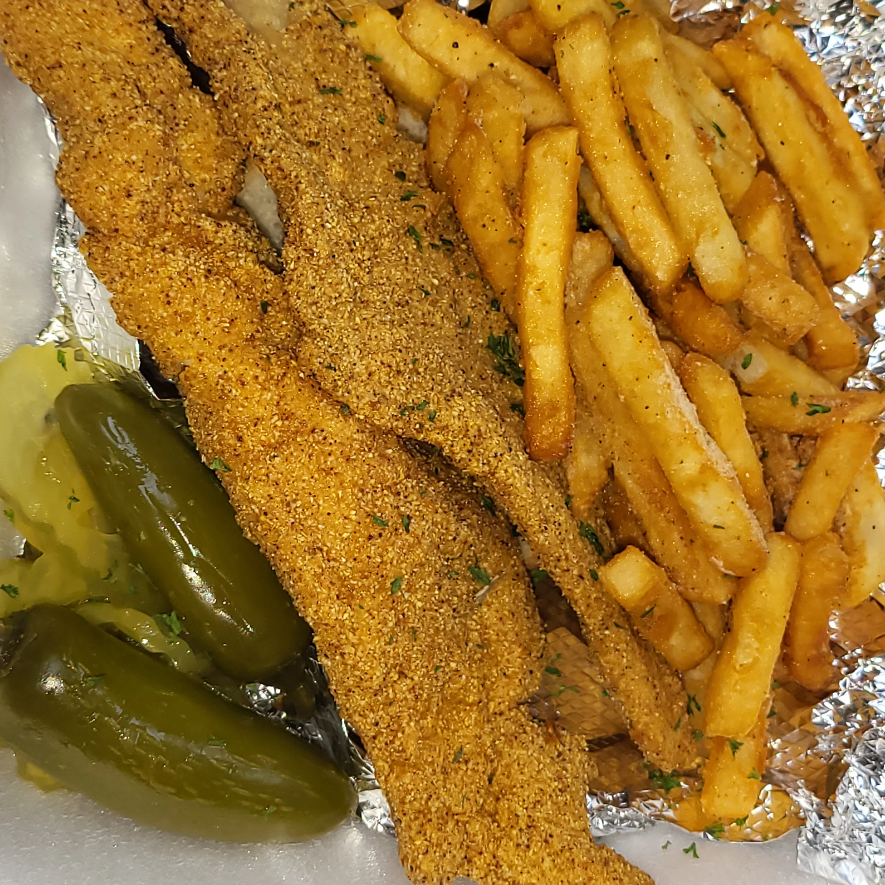 Southern fried catfish with fries and pickles