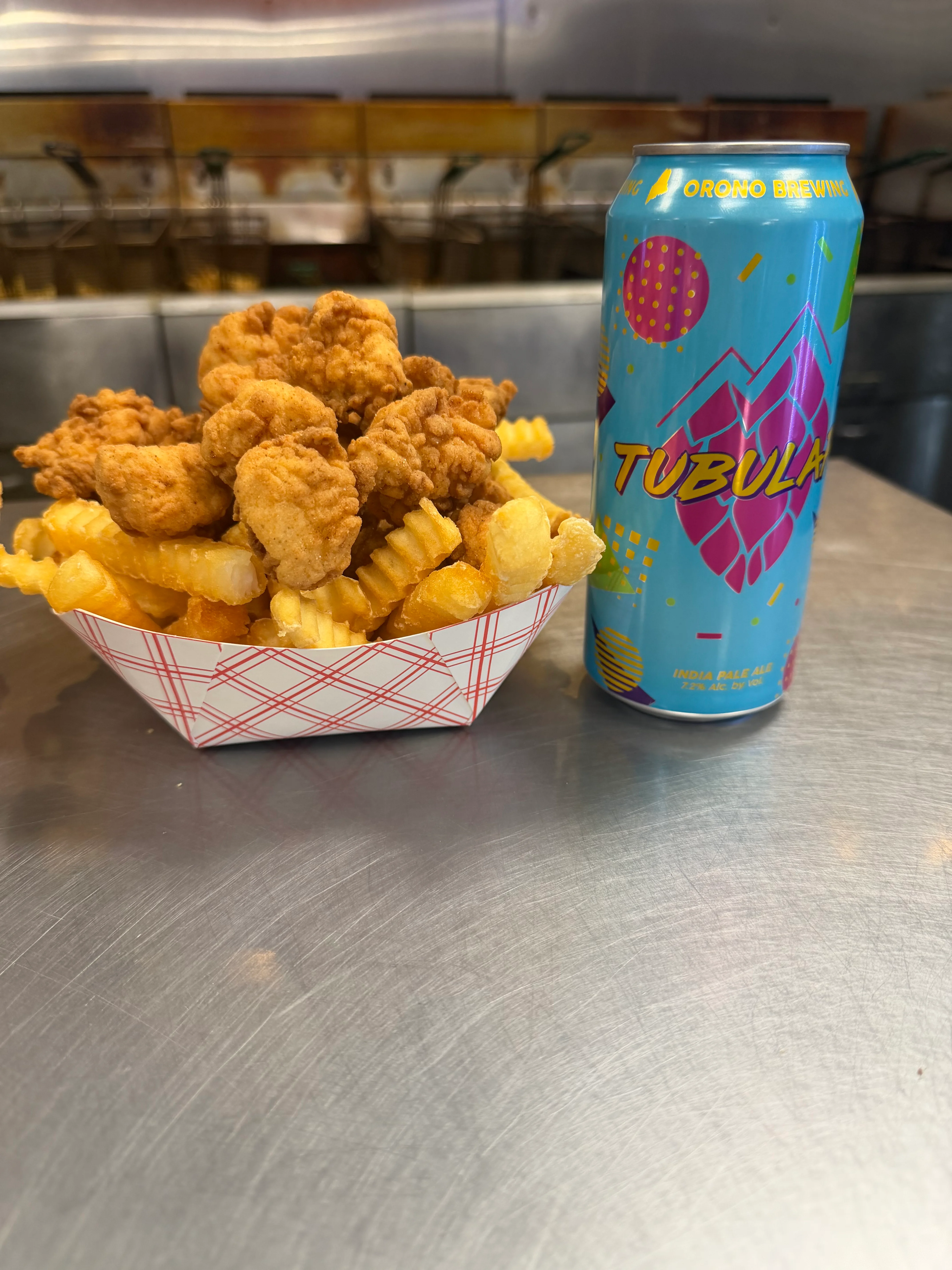 Crispy chicken and fries served with a craft beer