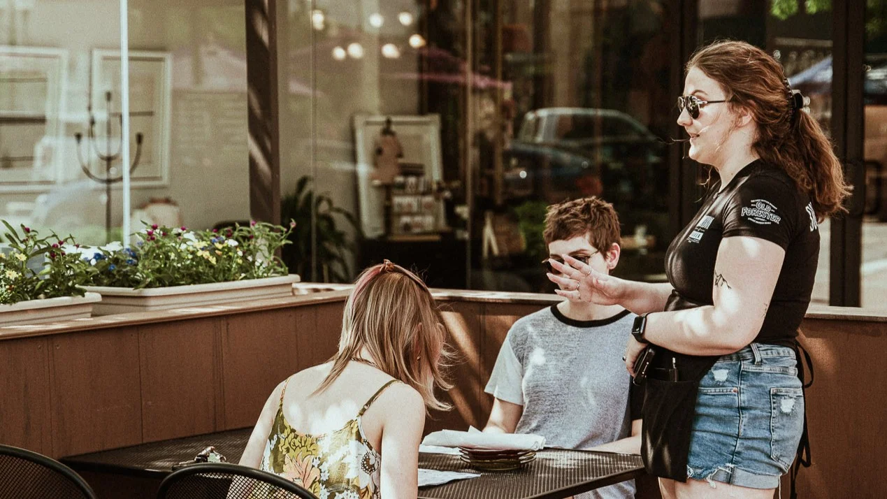 Waitress taking an order at an outdoor café