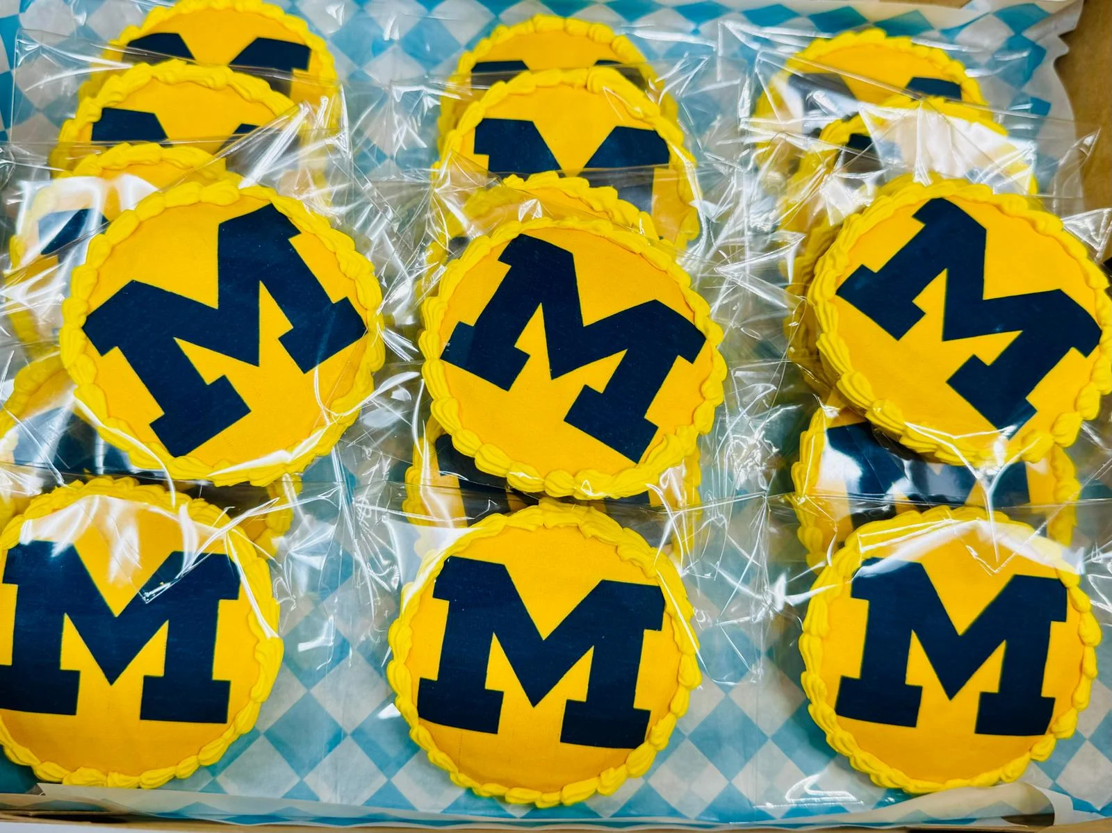 Decorative cookies with yellow and blue design for a celebration