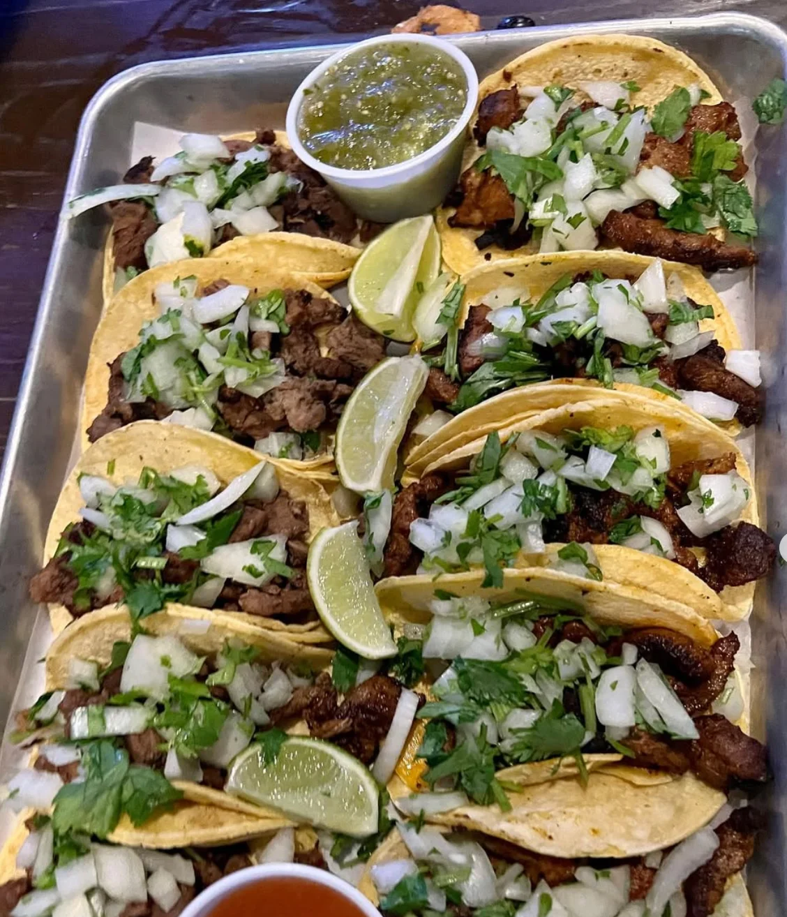 Delicious Mexican street tacos with cilantro and onions