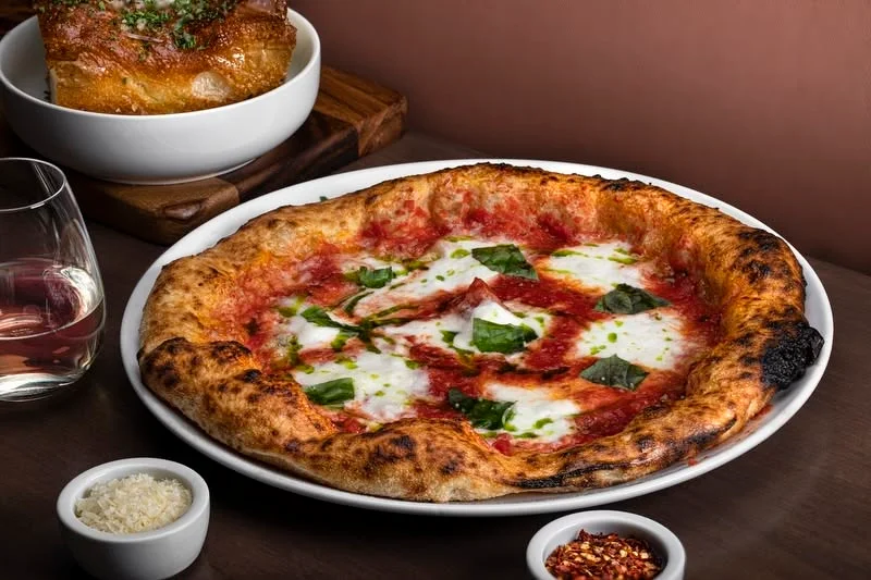 Margherita pizza with fresh basil and mozzarella
