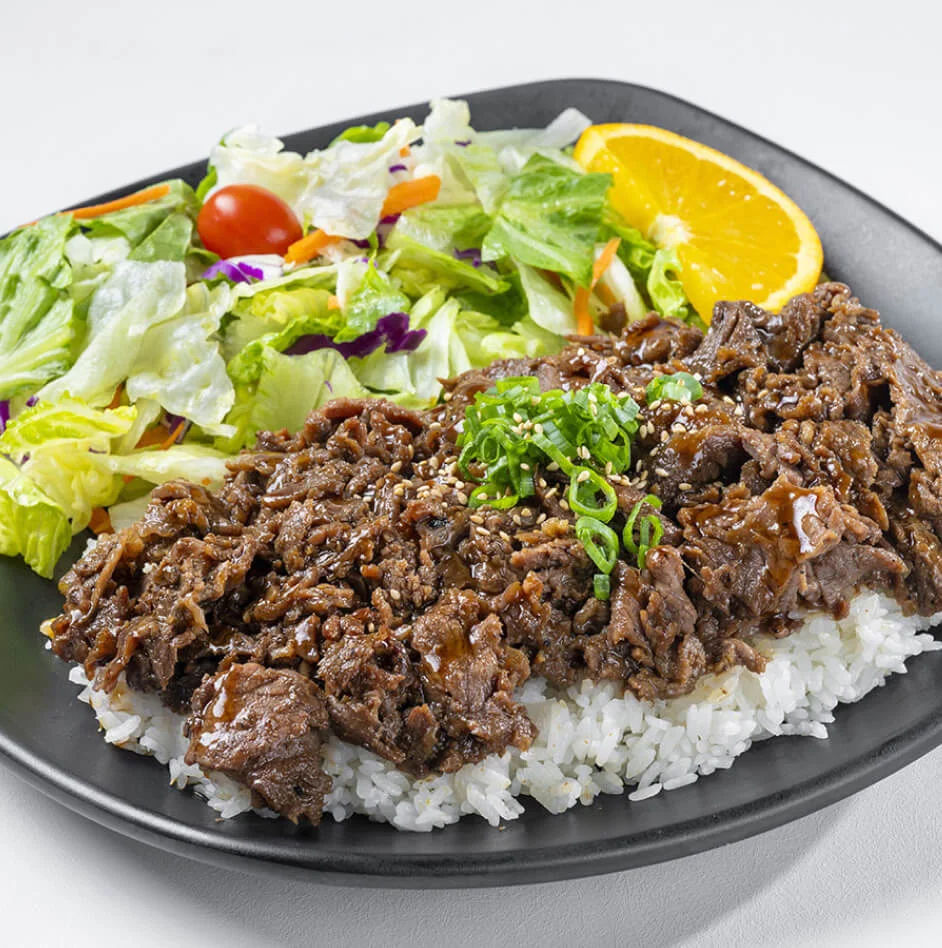 Korean bulgogi beef served with rice and fresh salad