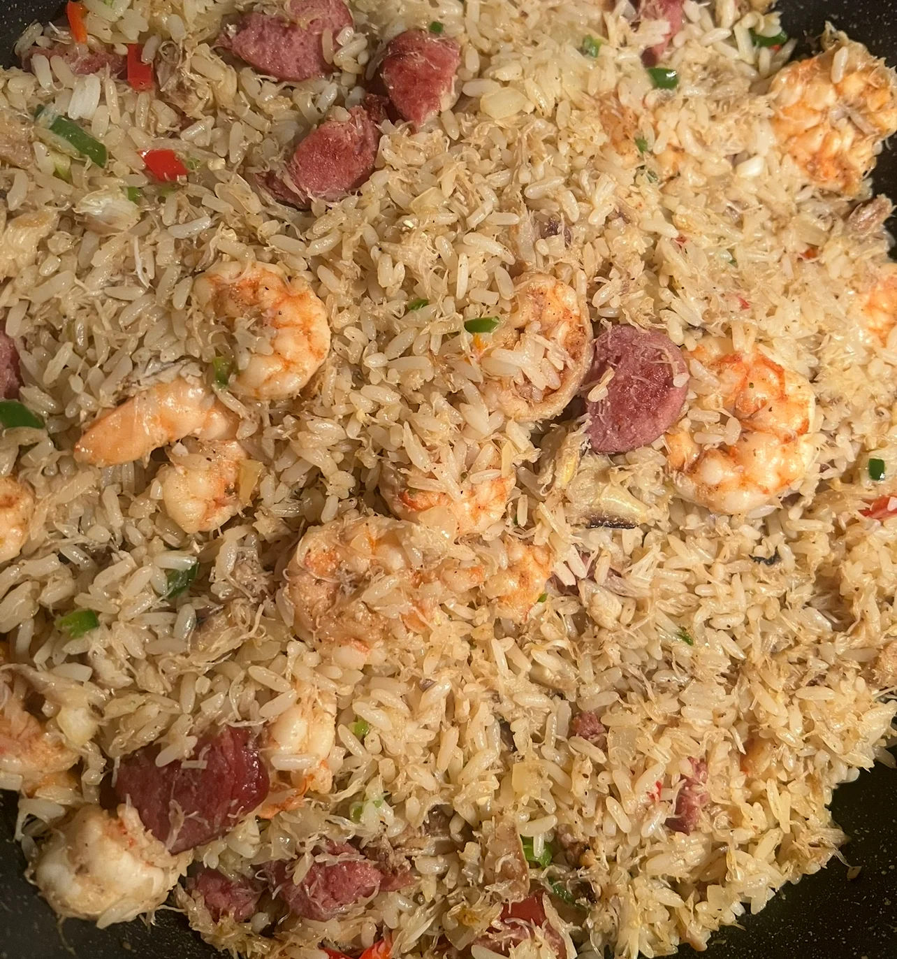 Shrimp fried rice with sausage in a skillet