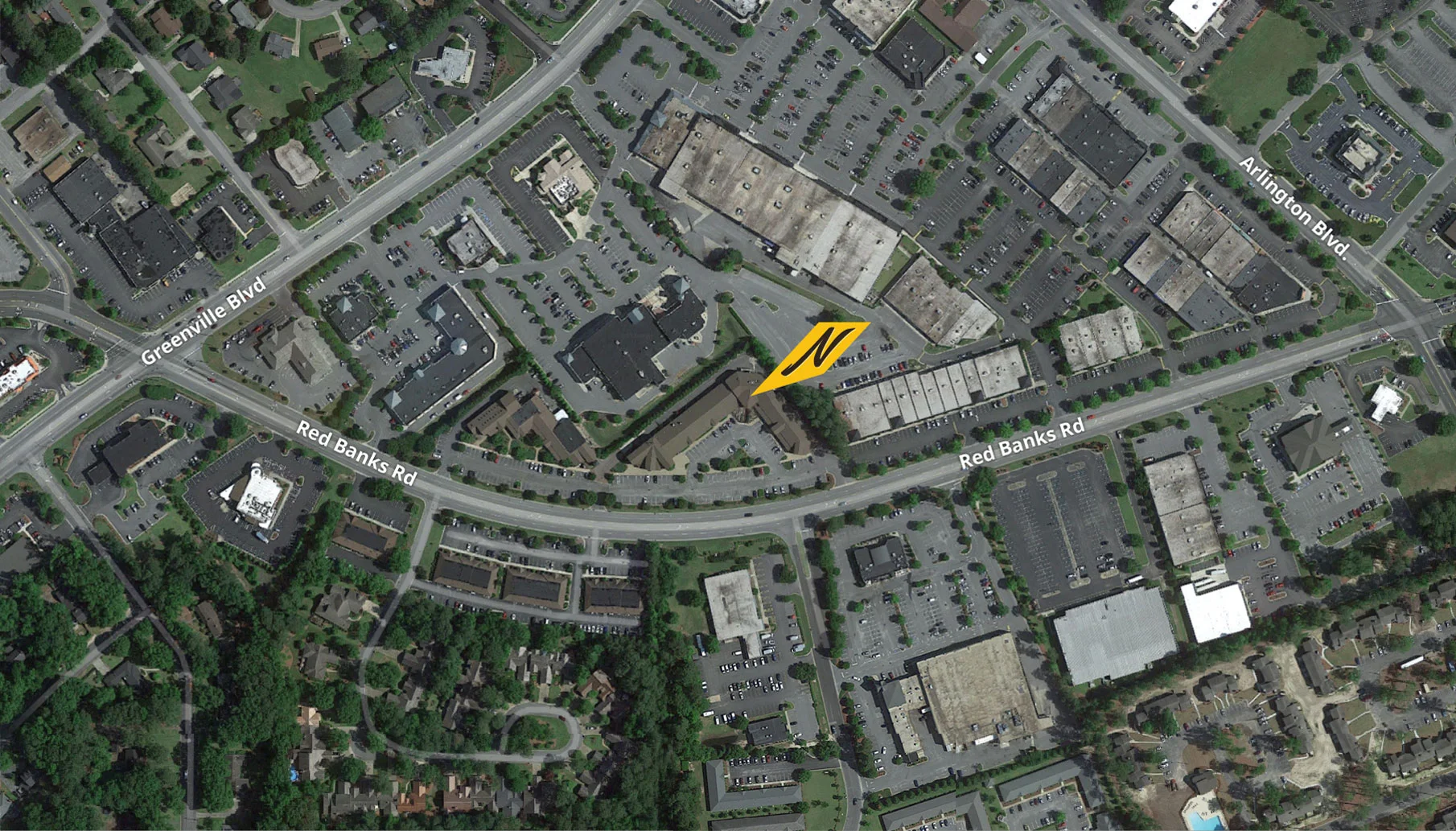 Aerial view of a busy intersection with shopping areas