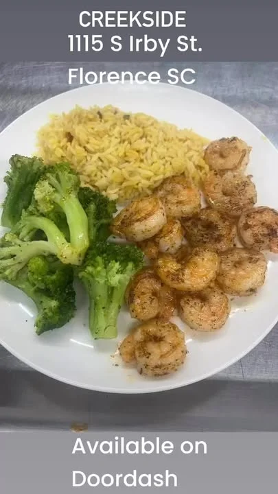 Cajun shrimp with orzo and broccoli on a plate