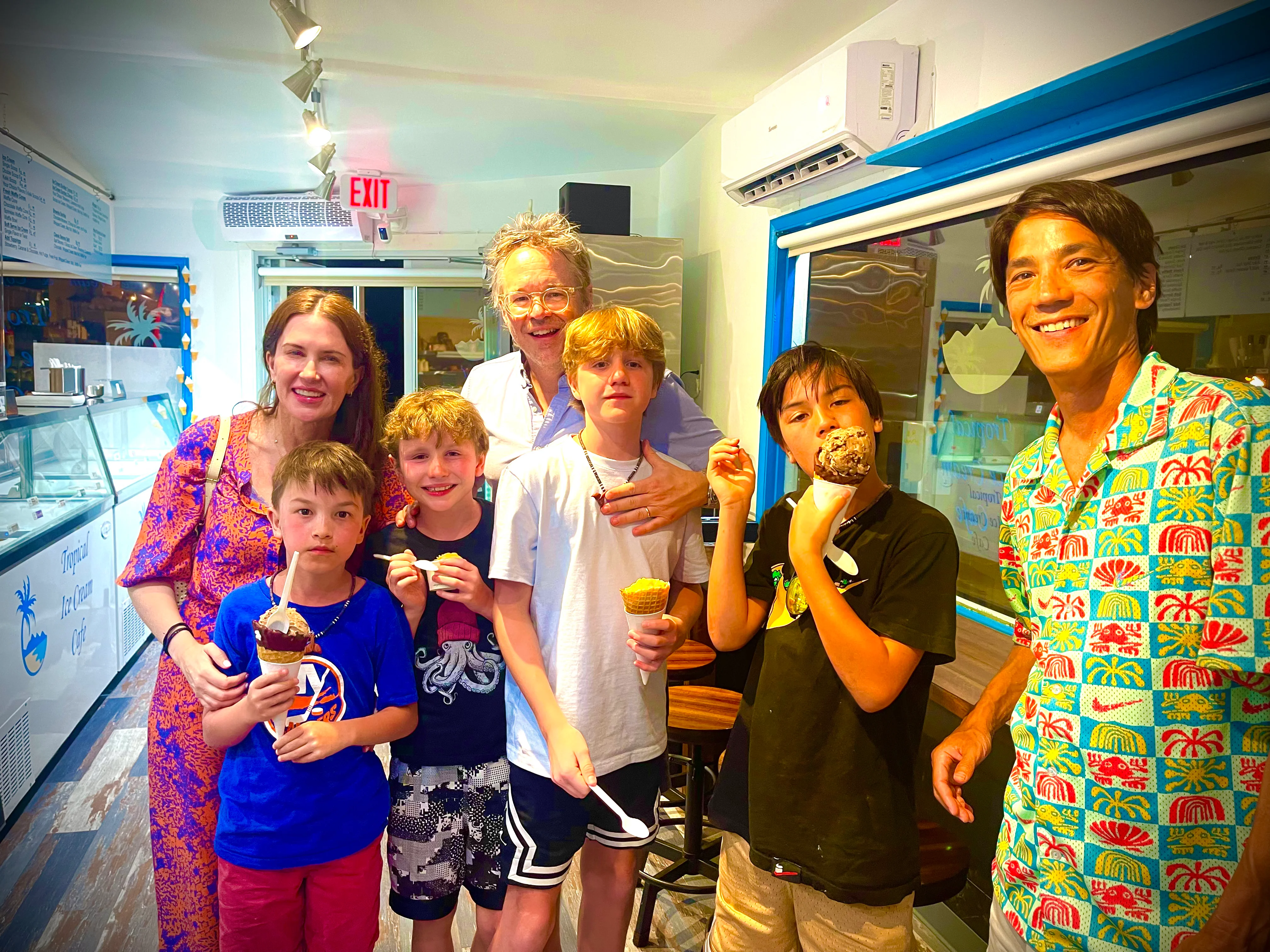 Family enjoying ice cream at a vibrant ice cream shop