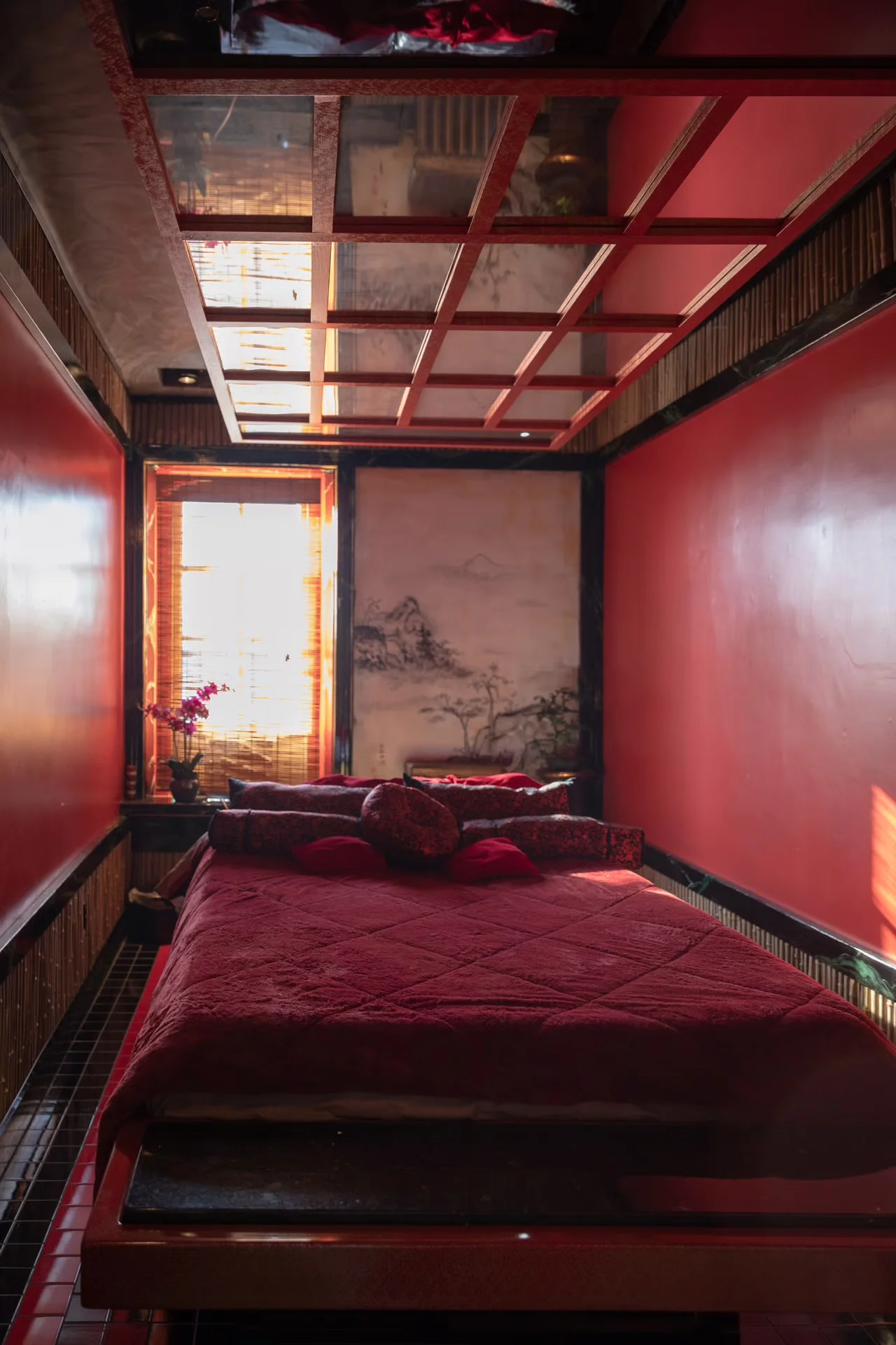 Cozy Asian-inspired room with red decor and natural light