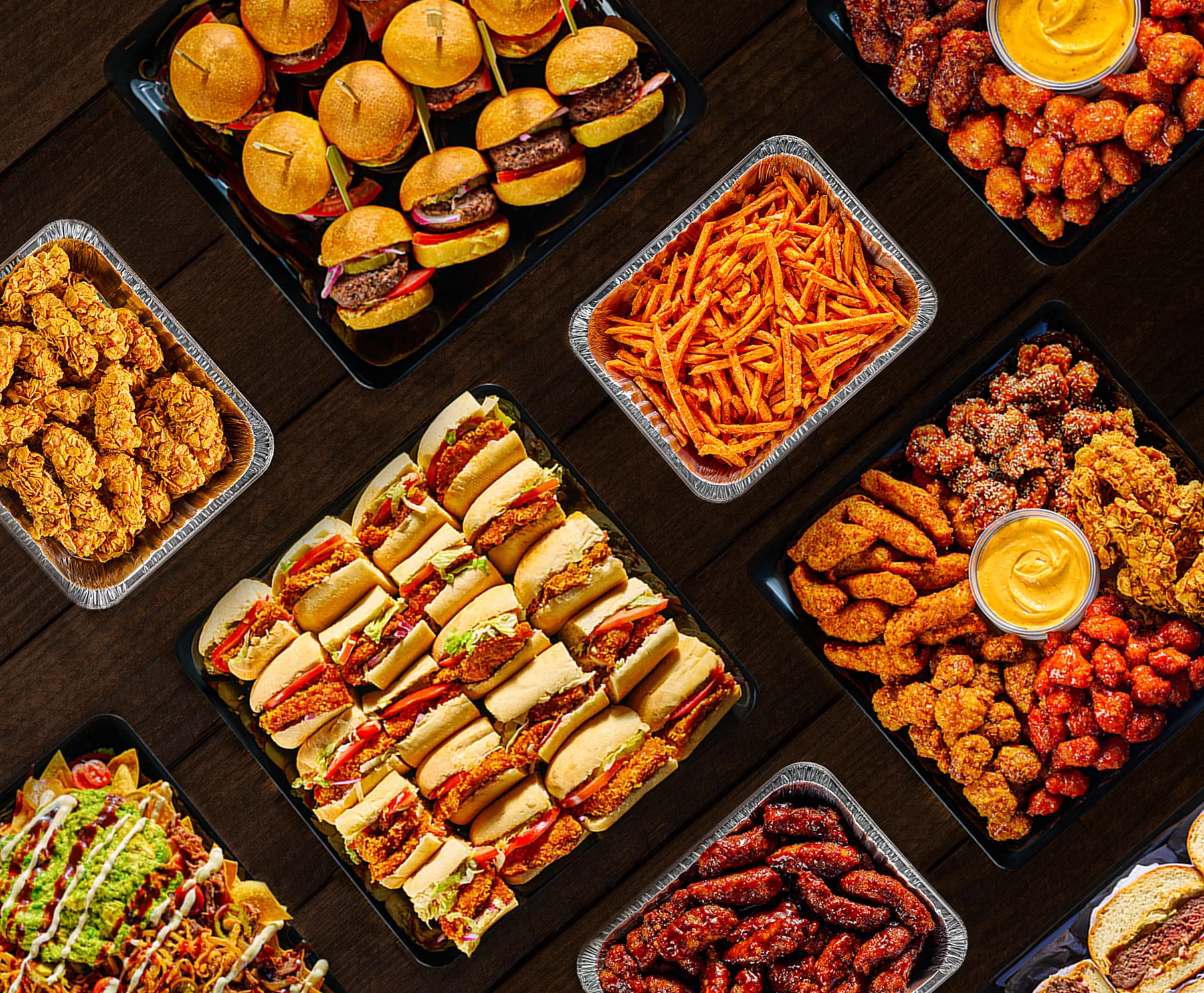 Assorted American party platters with sliders, wings, and nachos
