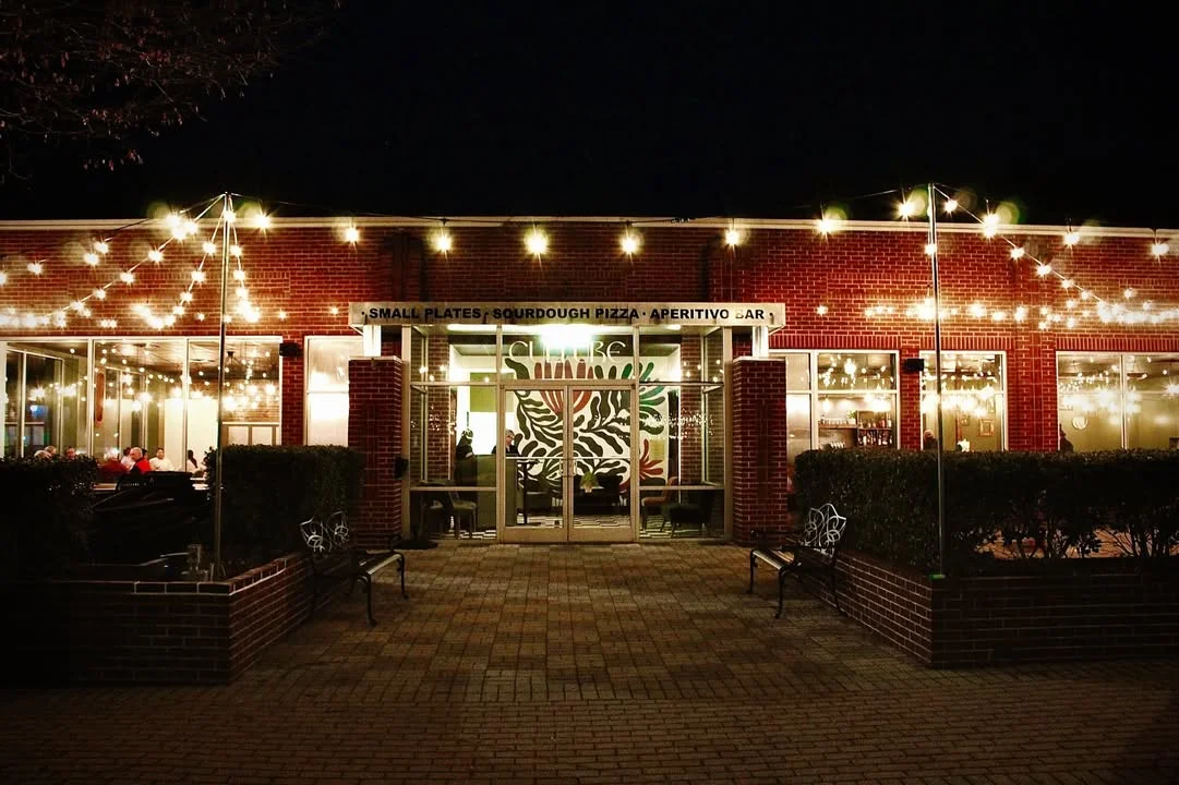 Charming restaurant entrance with string lights at night