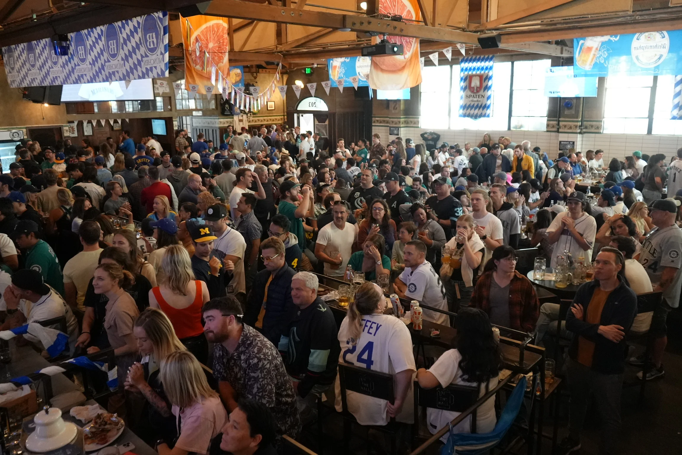 Crowded restaurant interior during a lively sports event