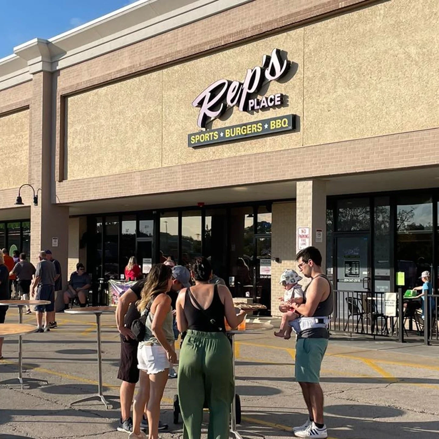 A group of friends outside of Rep's Place