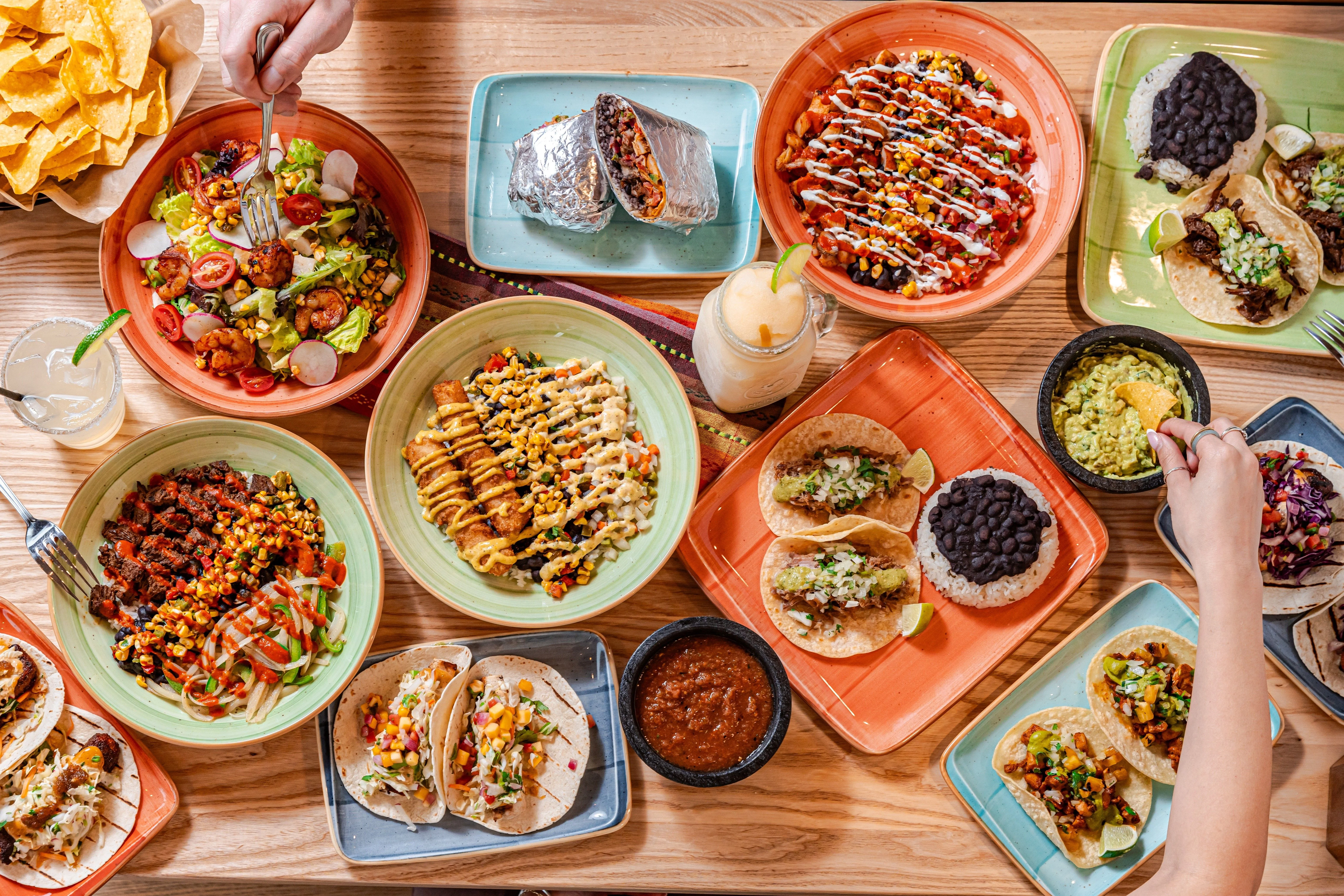 Colorful Mexican taco spread with guacamole and salsa