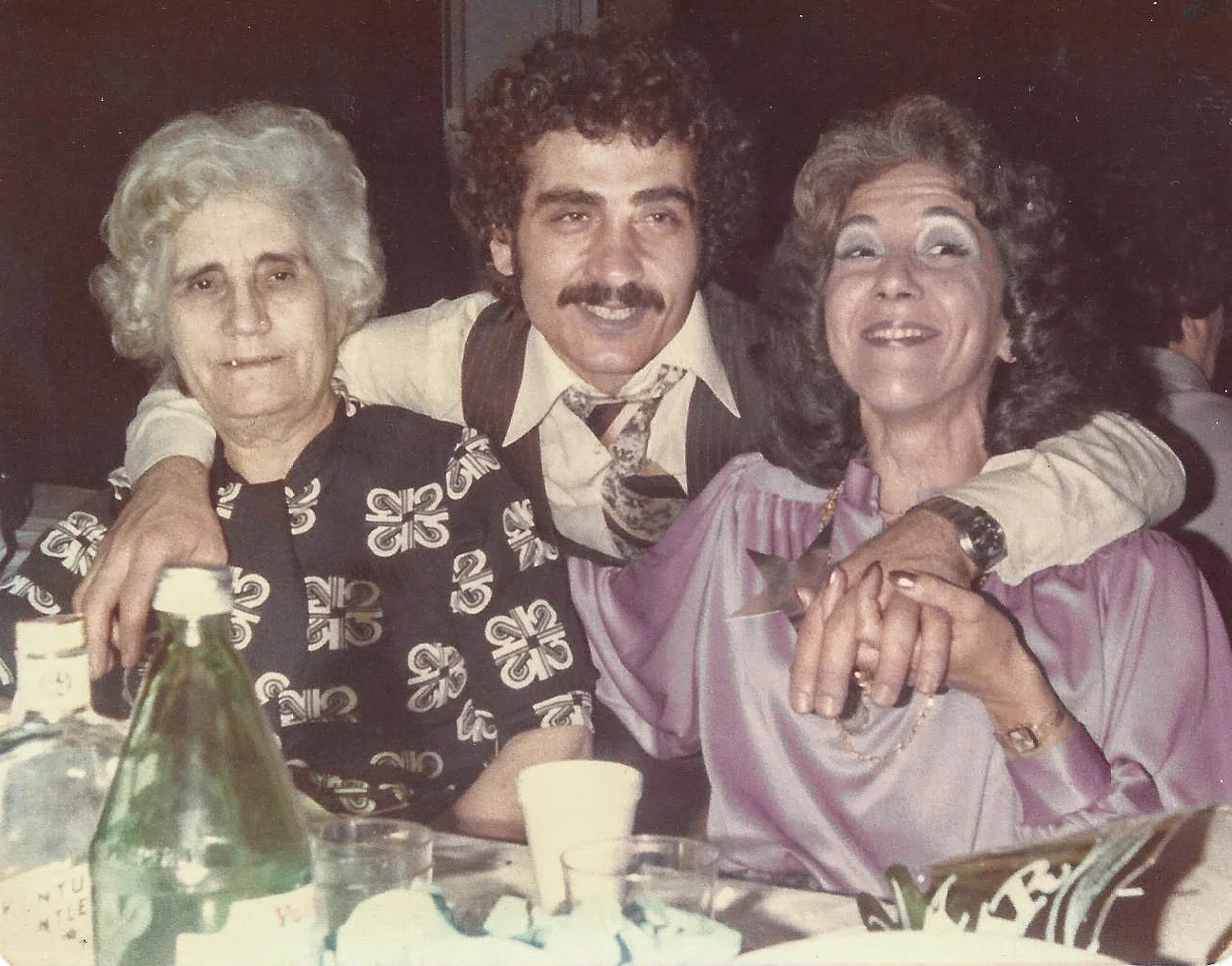 Group of three people enjoying a festive gathering