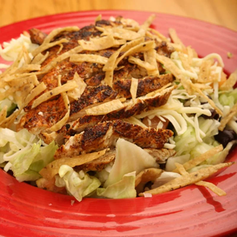 Grilled chicken salad with tortilla strips