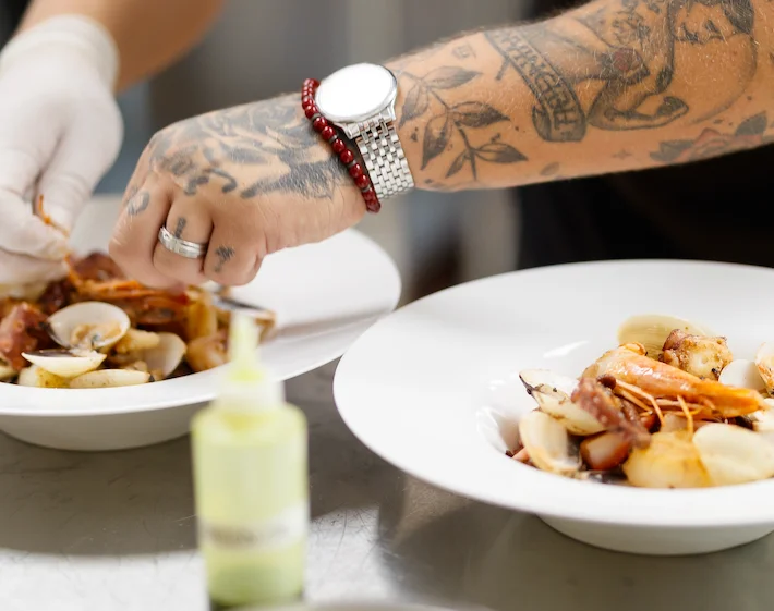 A restaurant chef preparing a dish