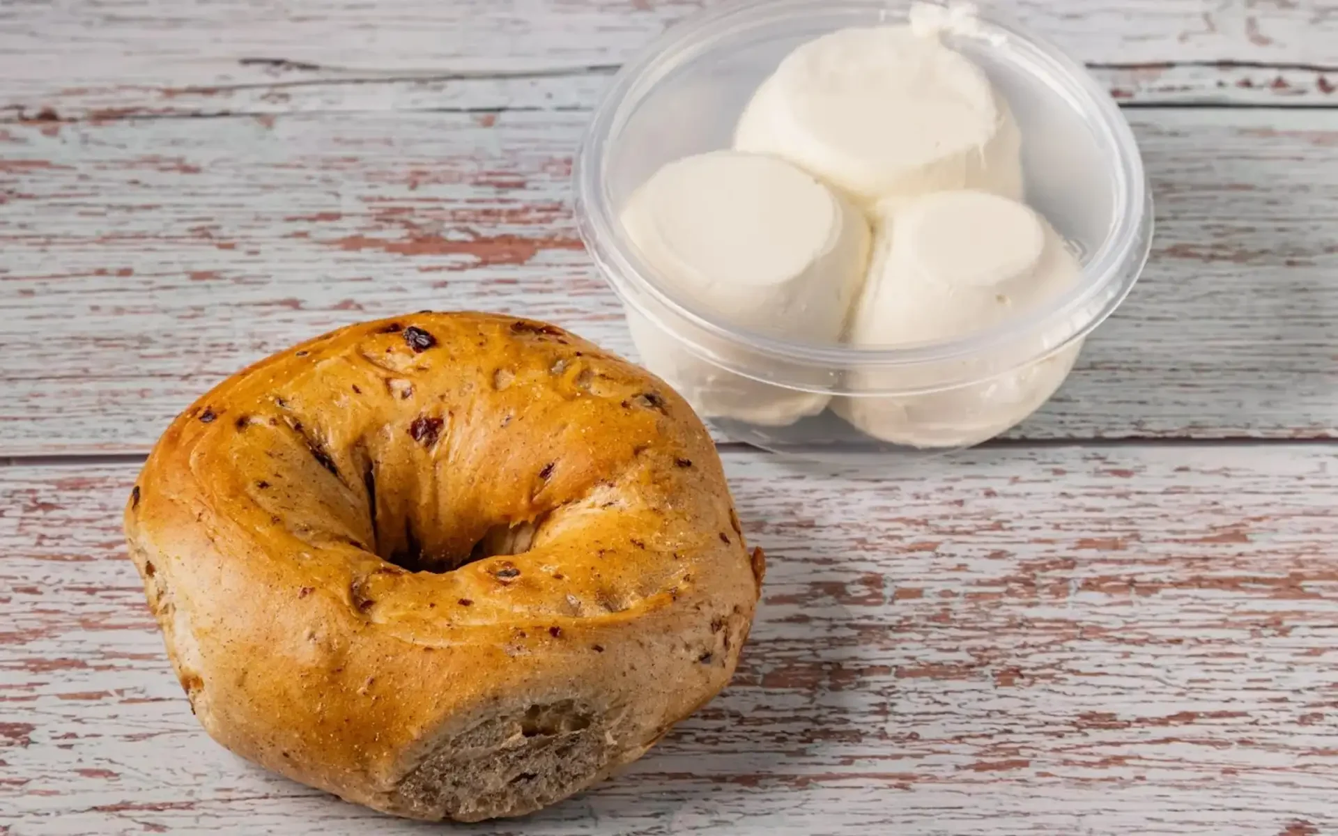 Freshly baked bagel with cream cheese