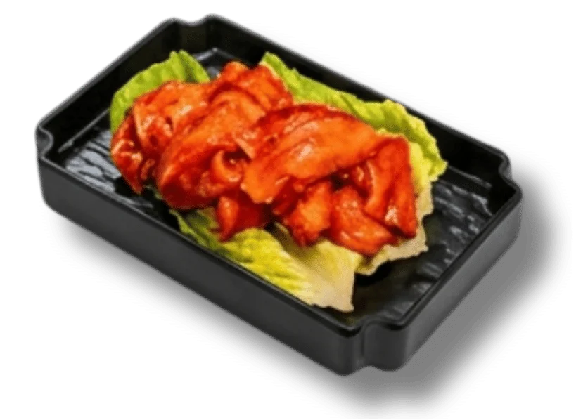 Grilled chicken served on lettuce in a black container.