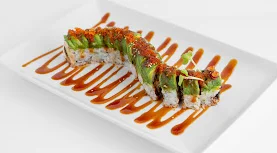 Japanese sushi roll with avocado and eel sauce presentation