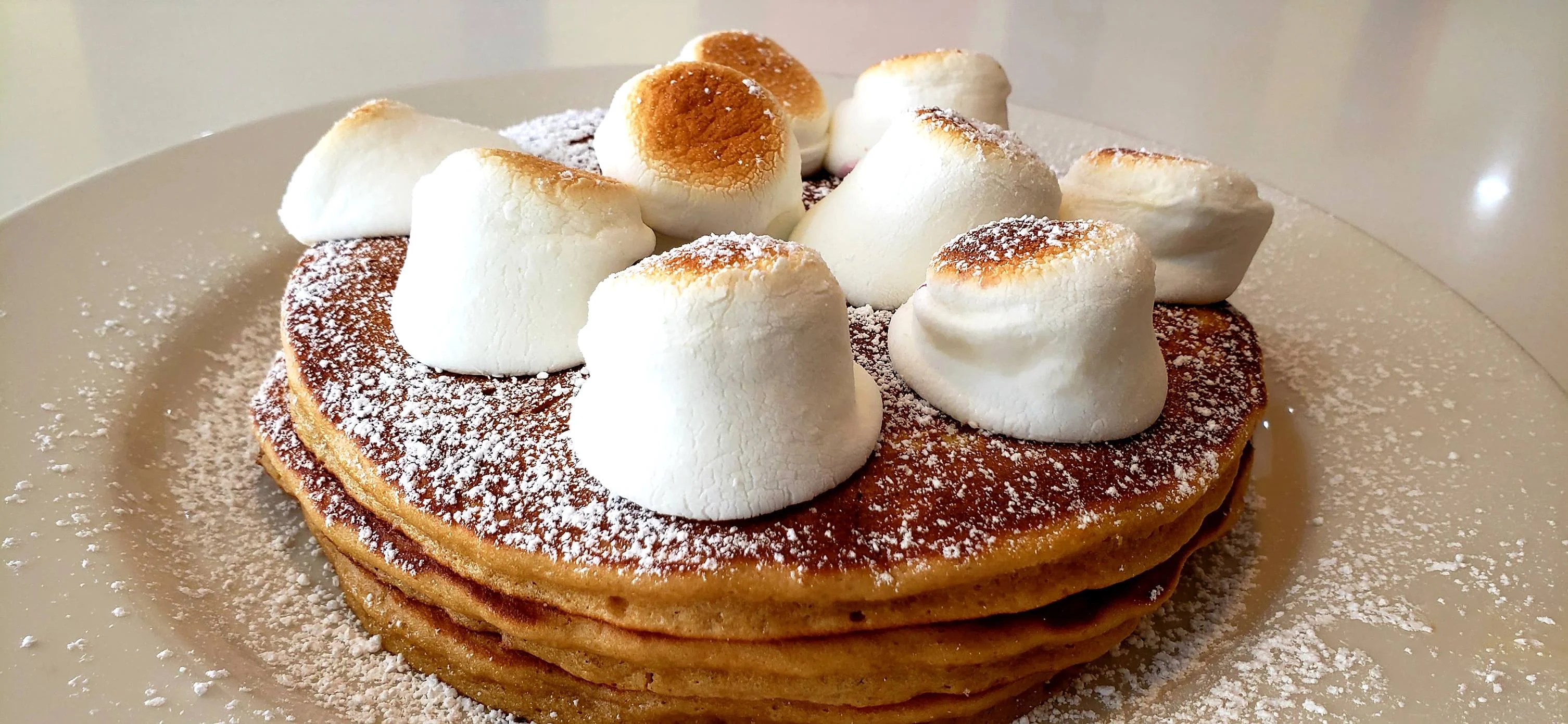 Fluffy pancakes topped with toasted marshmallows