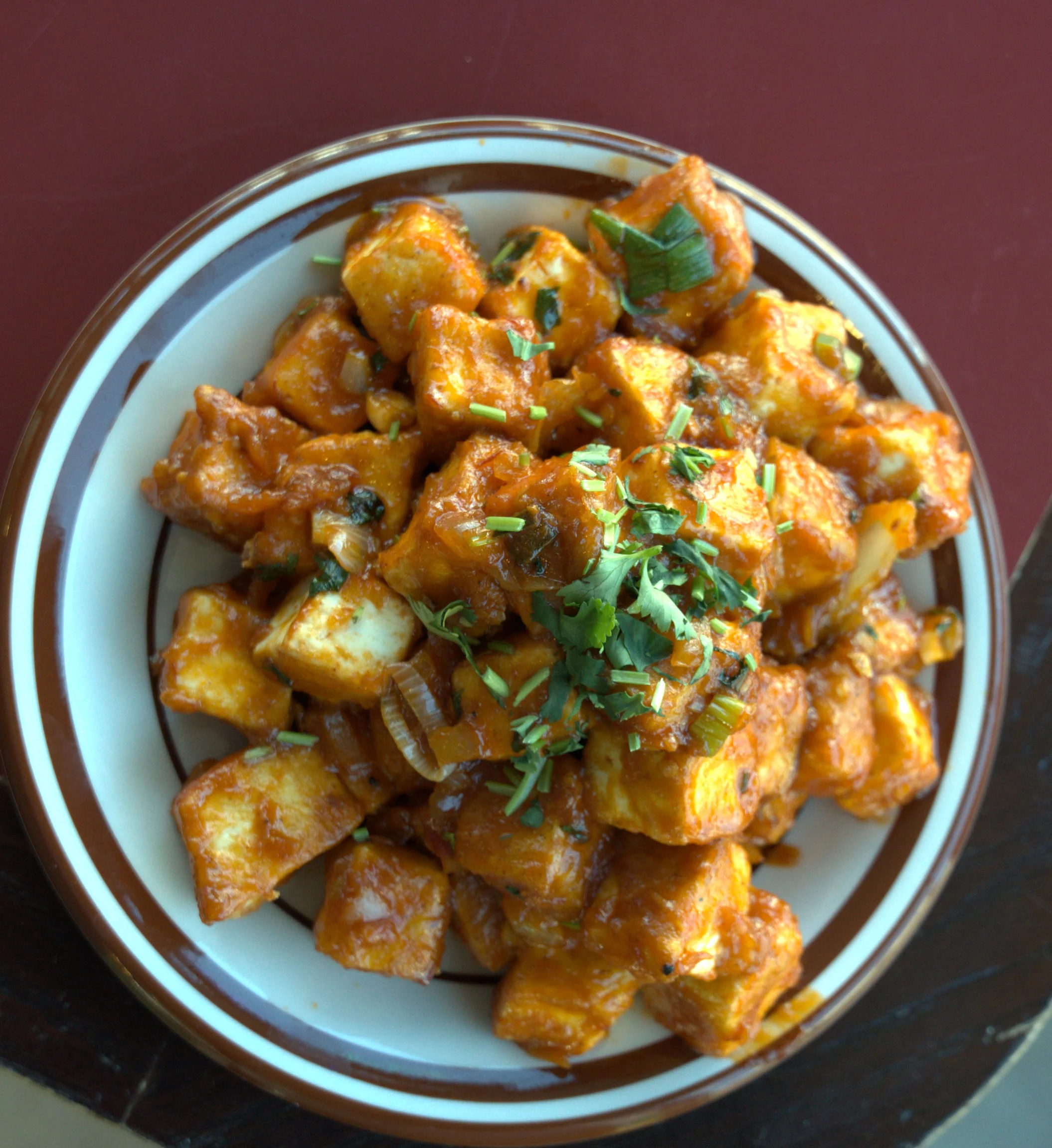 Spicy Indian paneer tikka served on a plate
