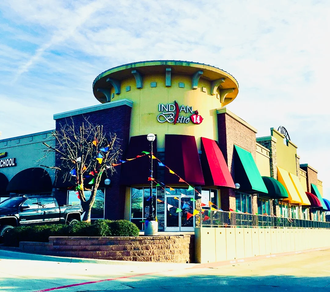 Exterior view of Indian restaurant with vibrant signage