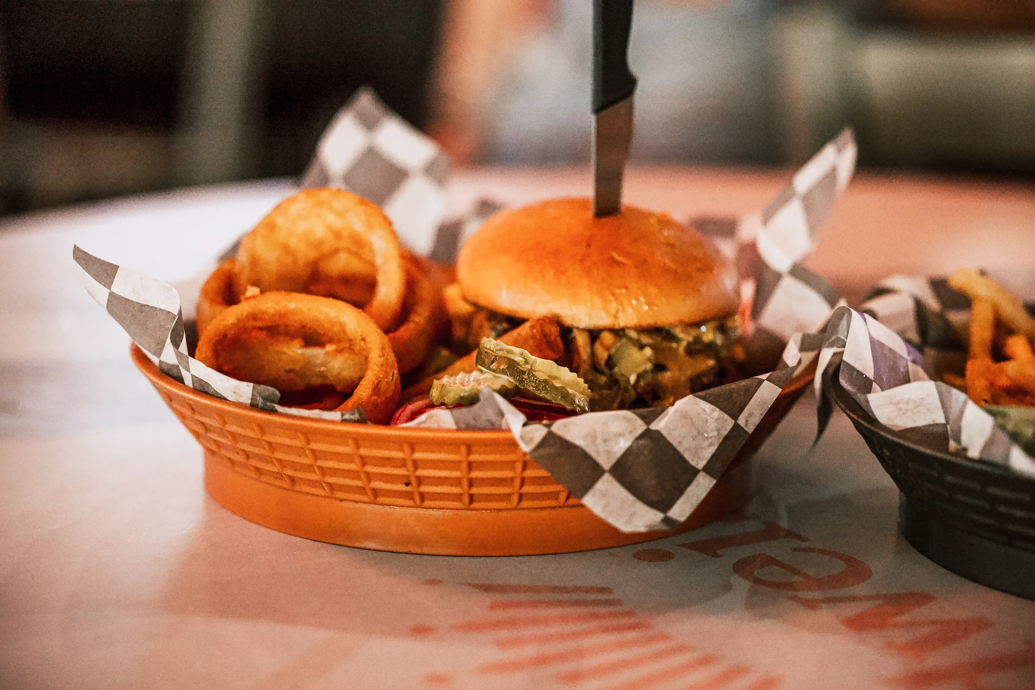 Juicy American cheeseburger with onion rings