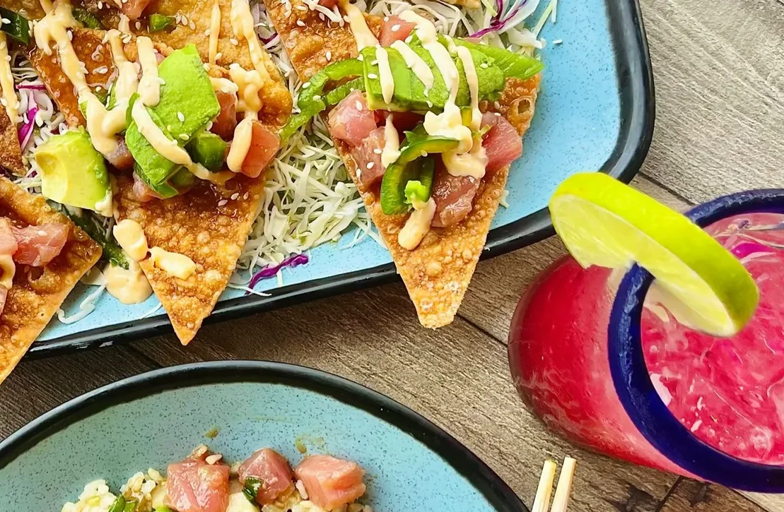 Crispy nachos topped with fresh salsa and avocado