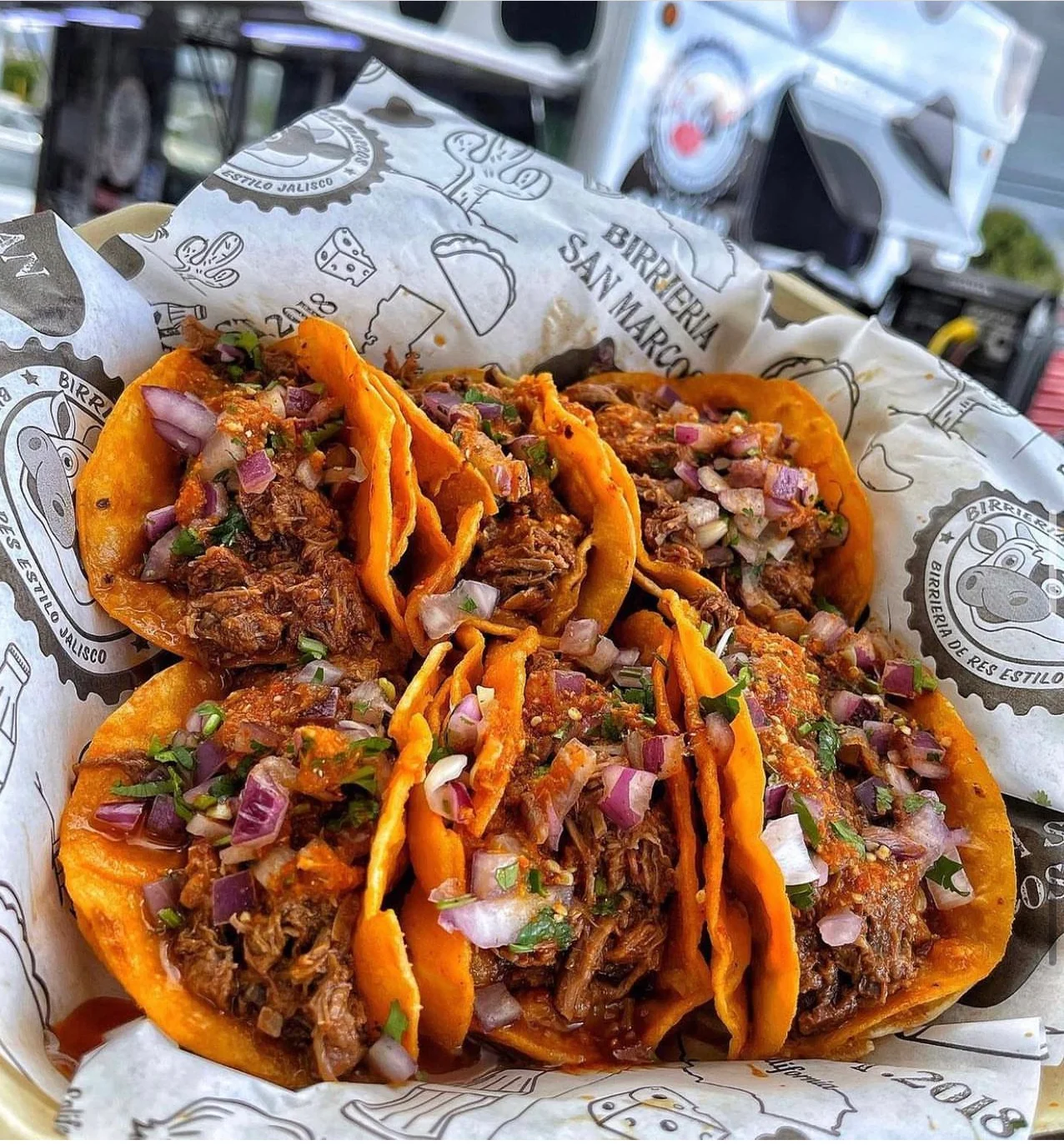 Authentic Mexican birria tacos served with fresh toppings
