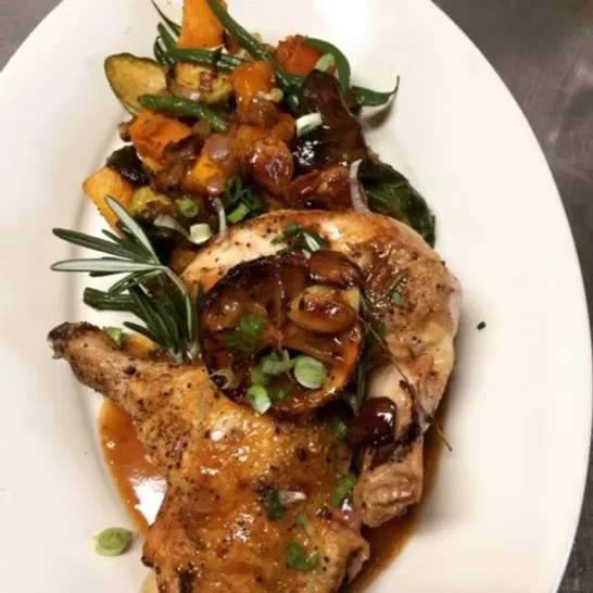 Herb-roasted chicken with seasonal vegetables