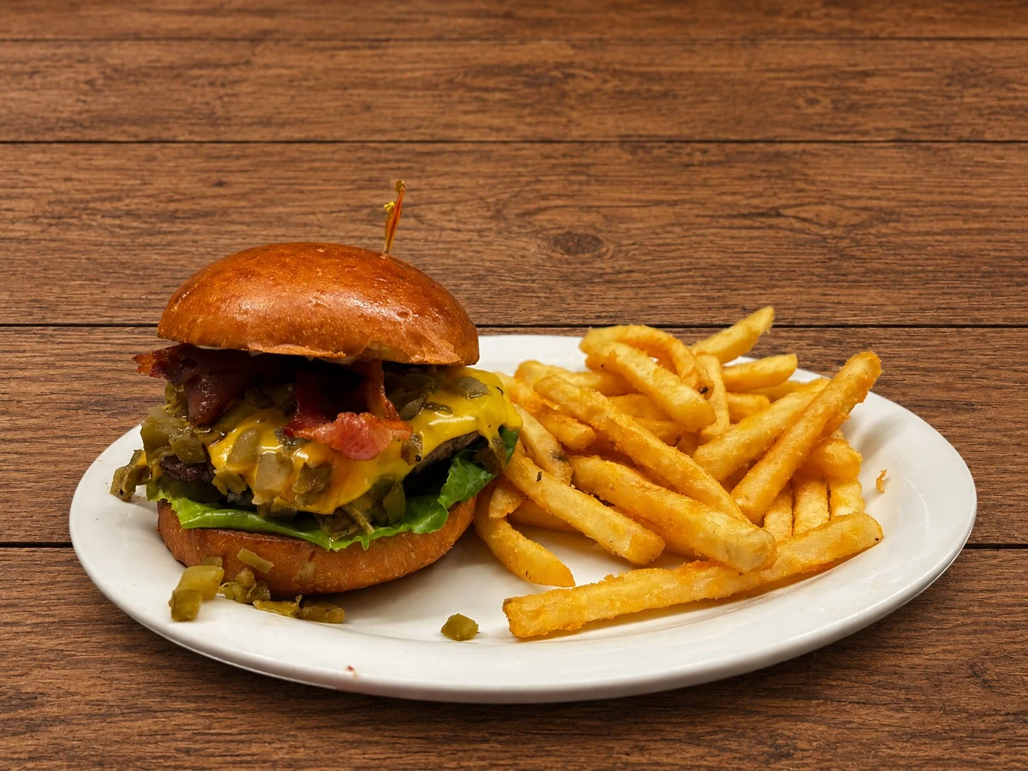 Juicy cheeseburger with bacon and fries