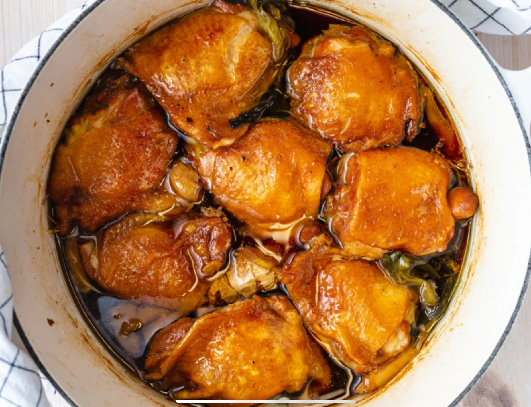 Savory braised chicken thighs in a Dutch oven