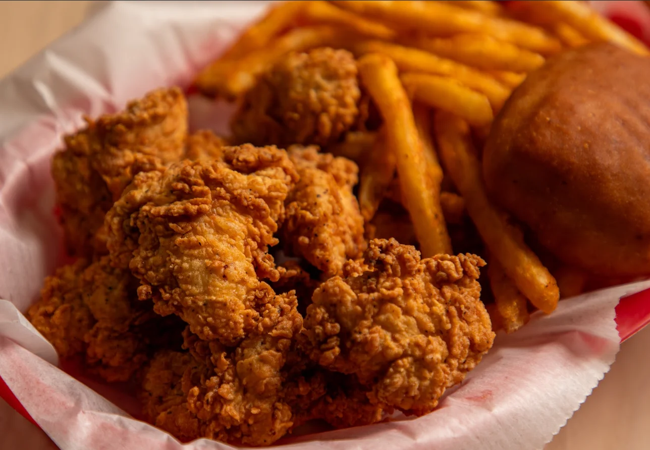 Southern fried chicken with fries and cornbread