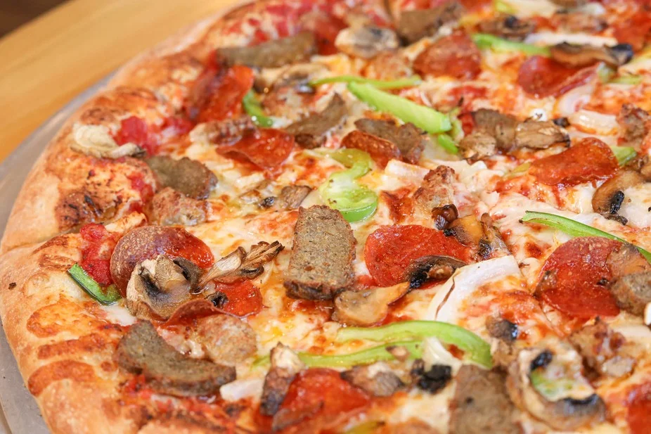 Delicious pepperoni and sausage pizza from a pizzeria