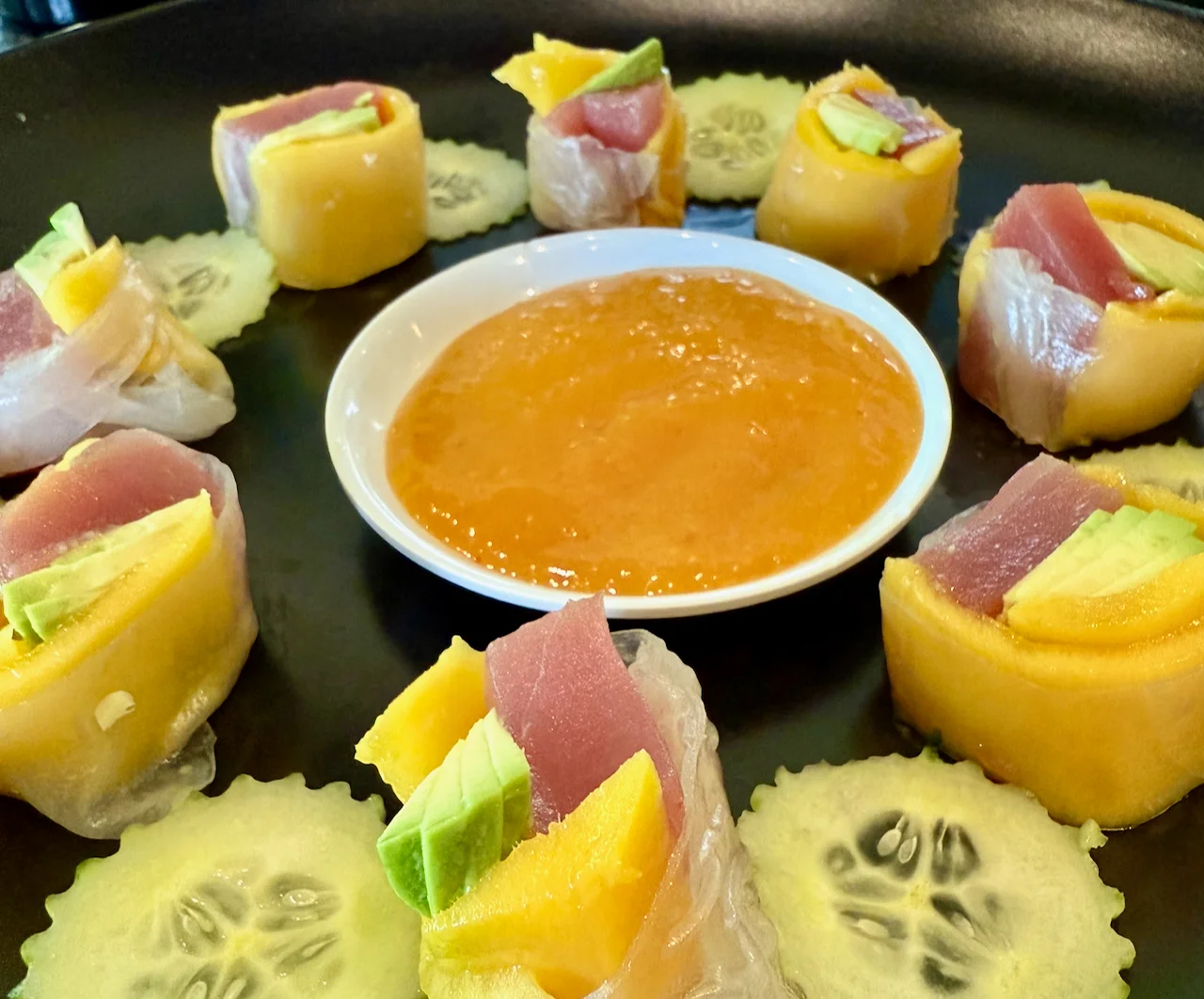 Japanese sushi rolls with fresh tuna and mango