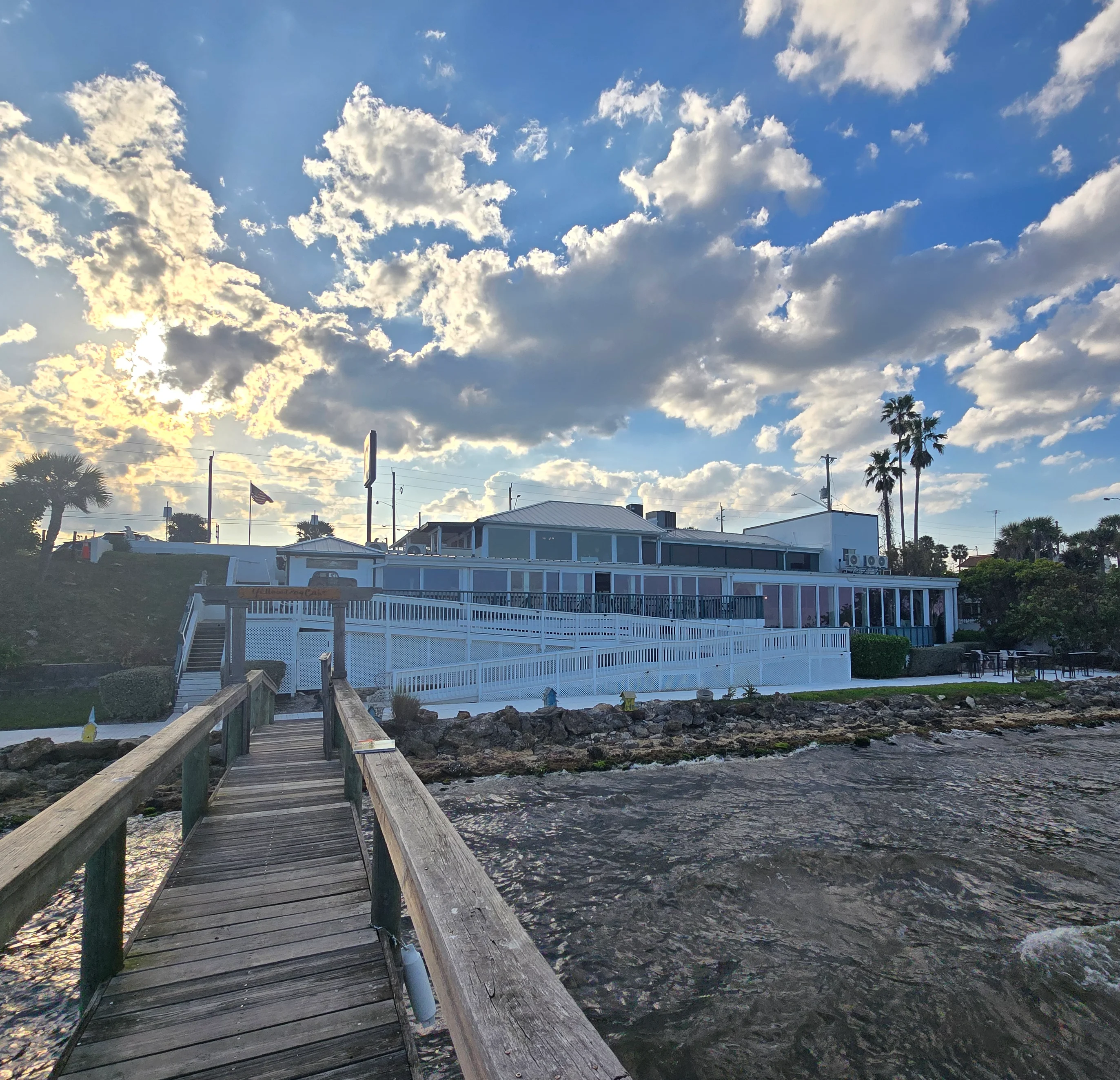 Scenic waterfront view of Yellow Dog Cafe at sunset