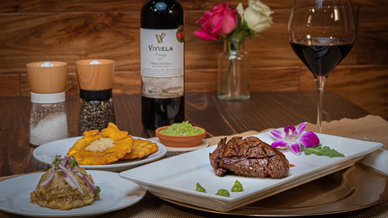 Grilled steak with plantains and chimichurri sauce
