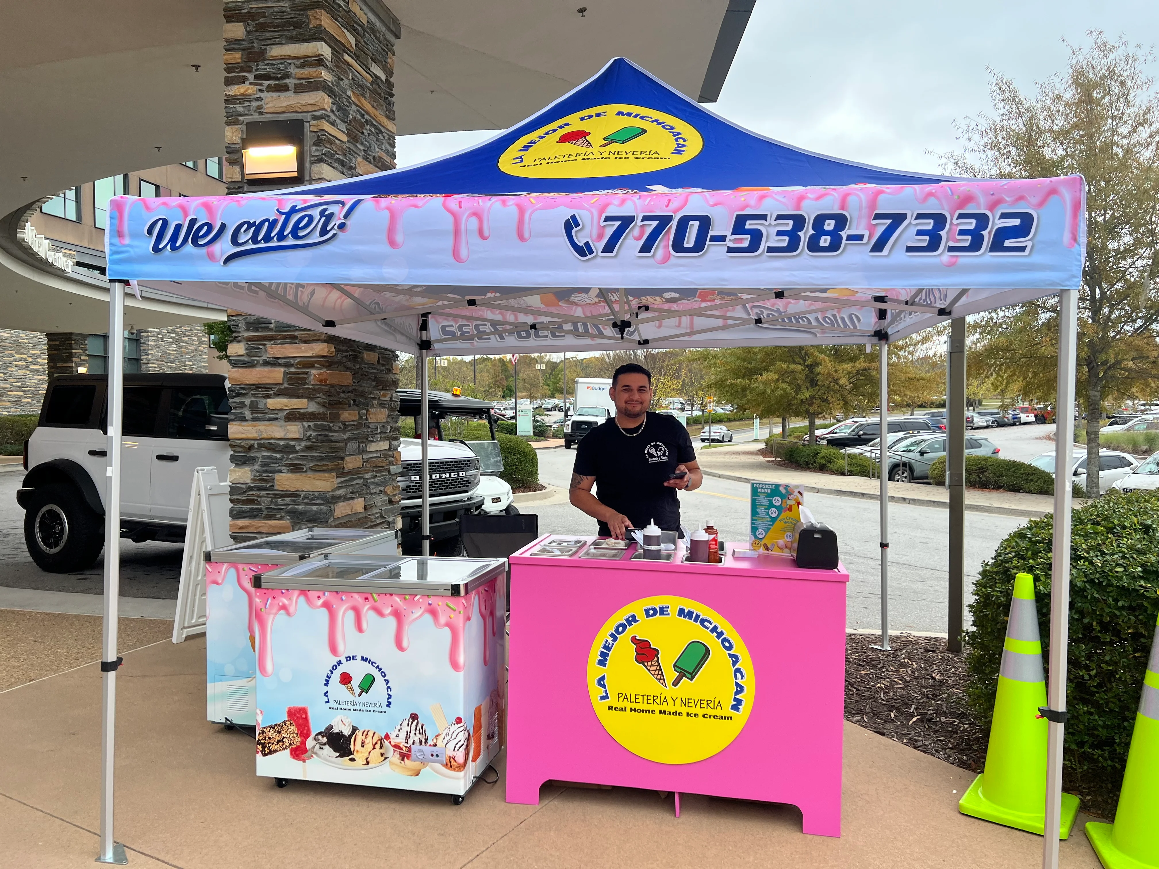 Colorful ice cream cart at an outdoor event