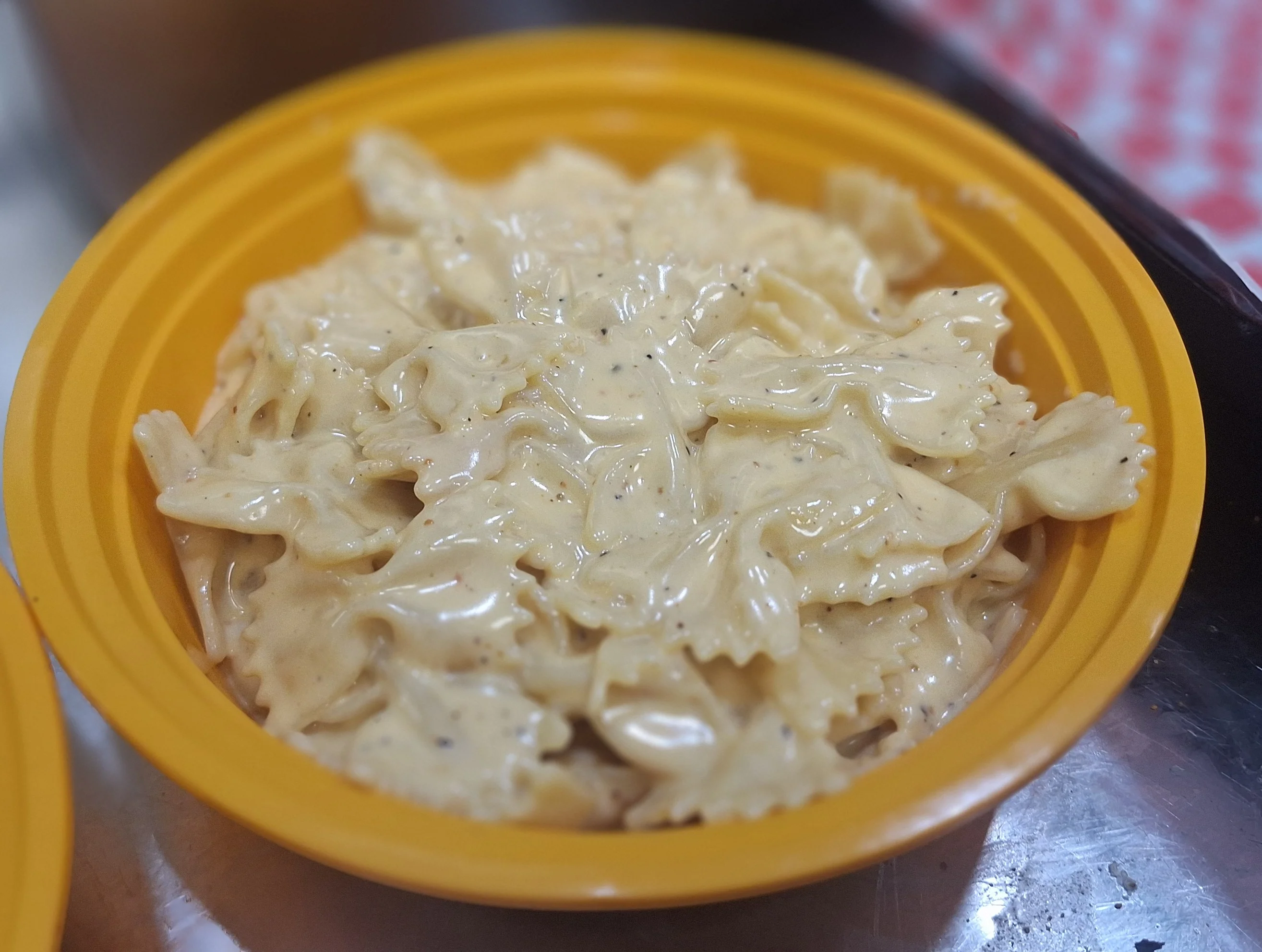 Creamy farfalle pasta in a vibrant bowl