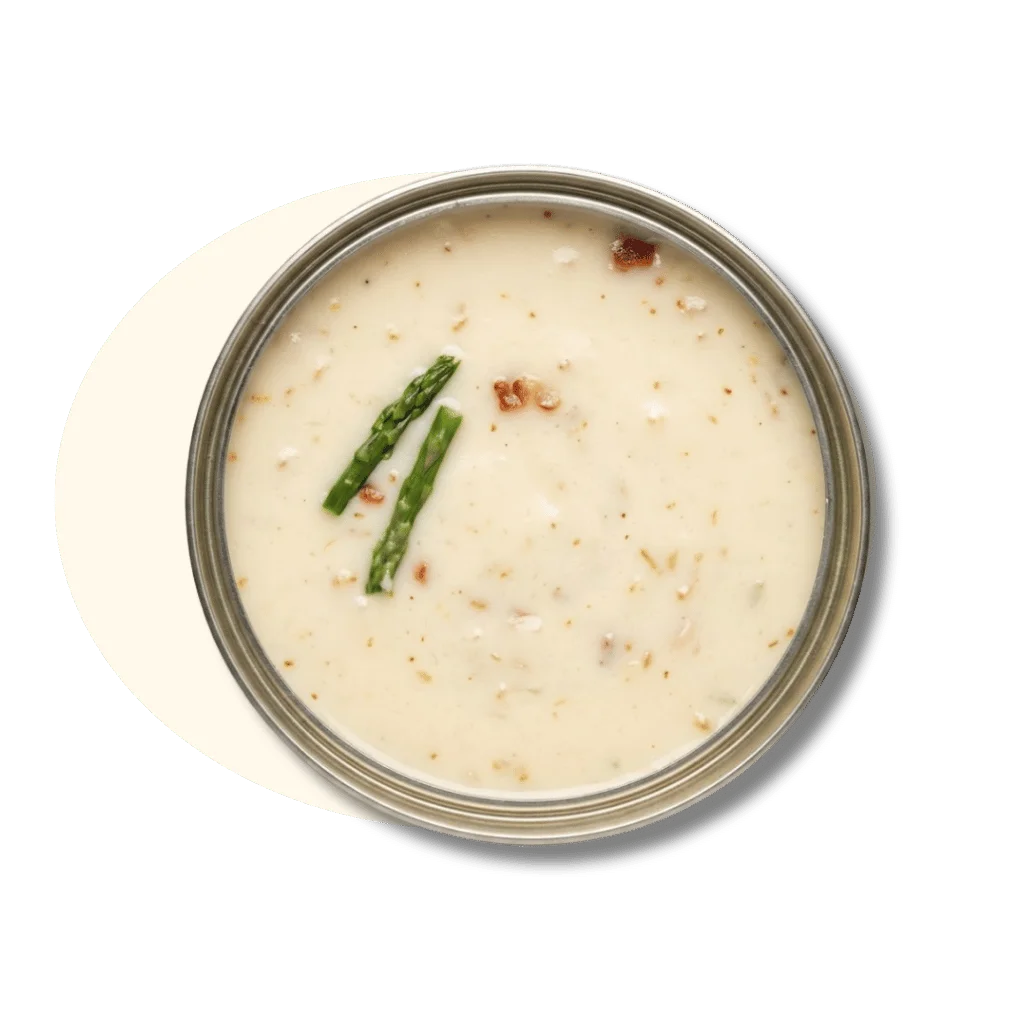 Creamy soup with asparagus and nuts in a jar