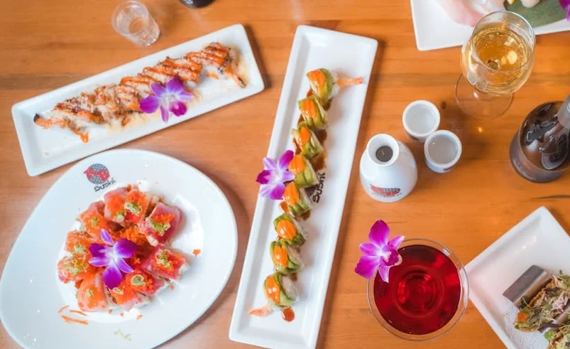 Assorted sushi platter featuring colorful rolls and sashimi