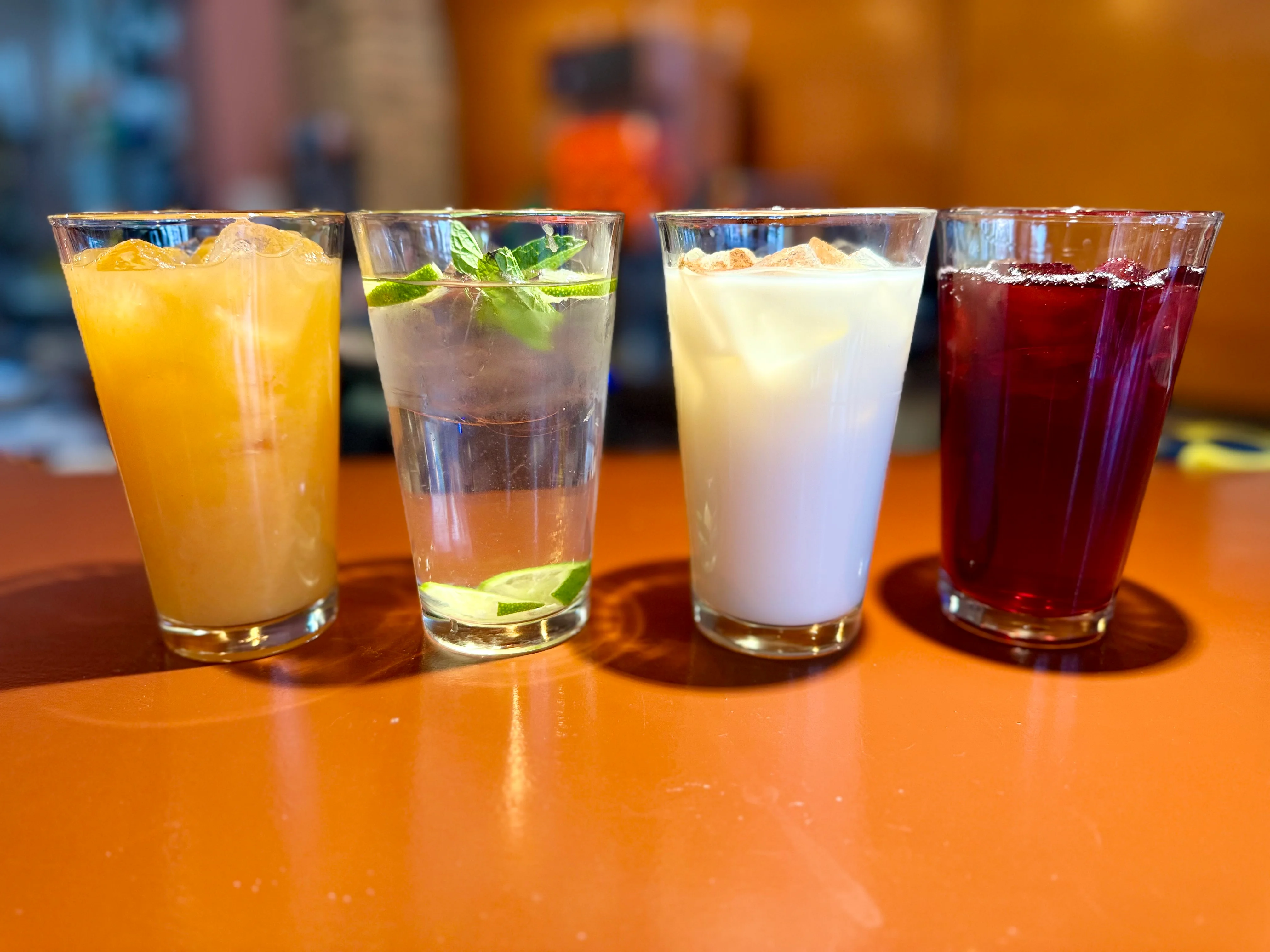Variety of refreshing beverages in clear glasses