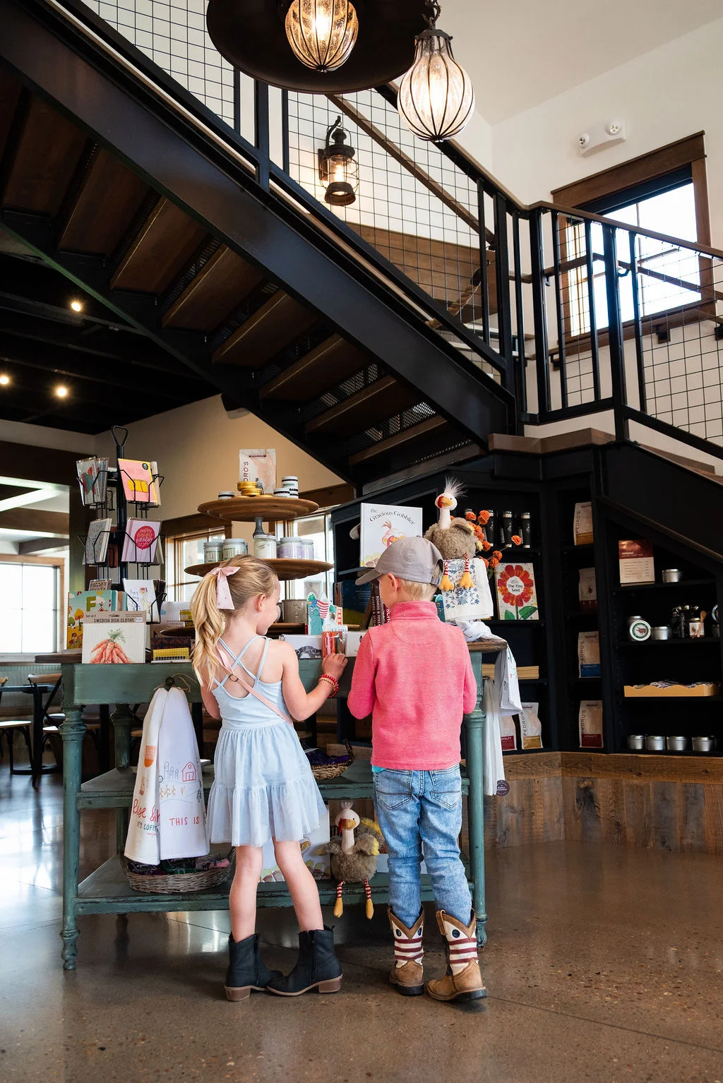 Children exploring a charming café gift shop