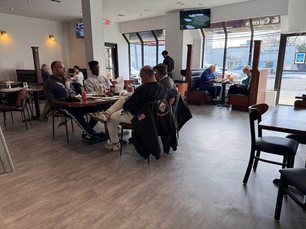 Cozy restaurant interior with patrons enjoying meals