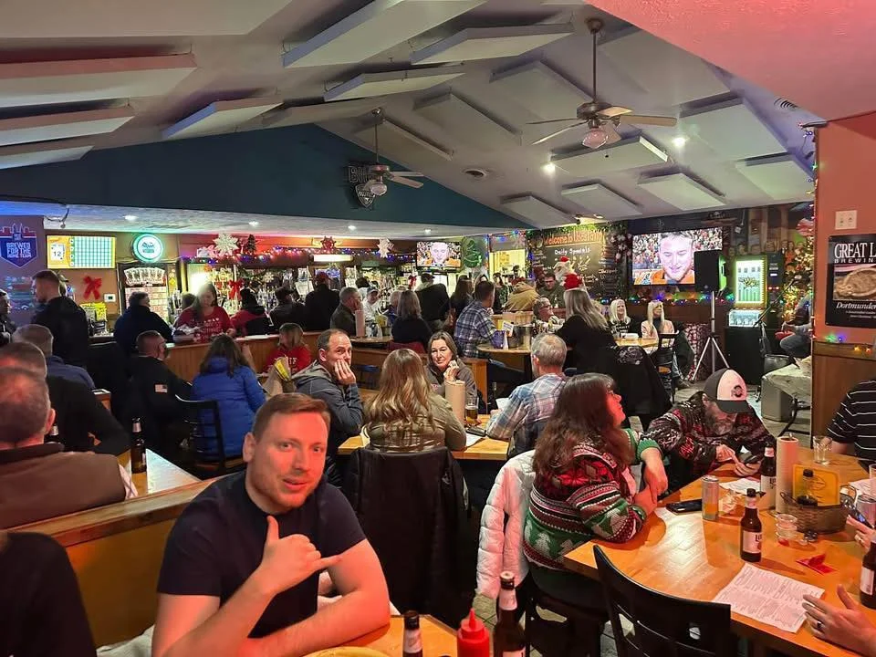 Lively restaurant interior with festive decor and patrons enjoying their evening