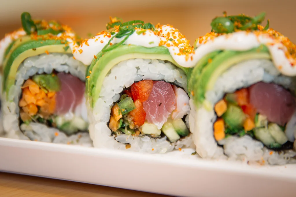 Colorful sushi rolls with avocado and tuna
