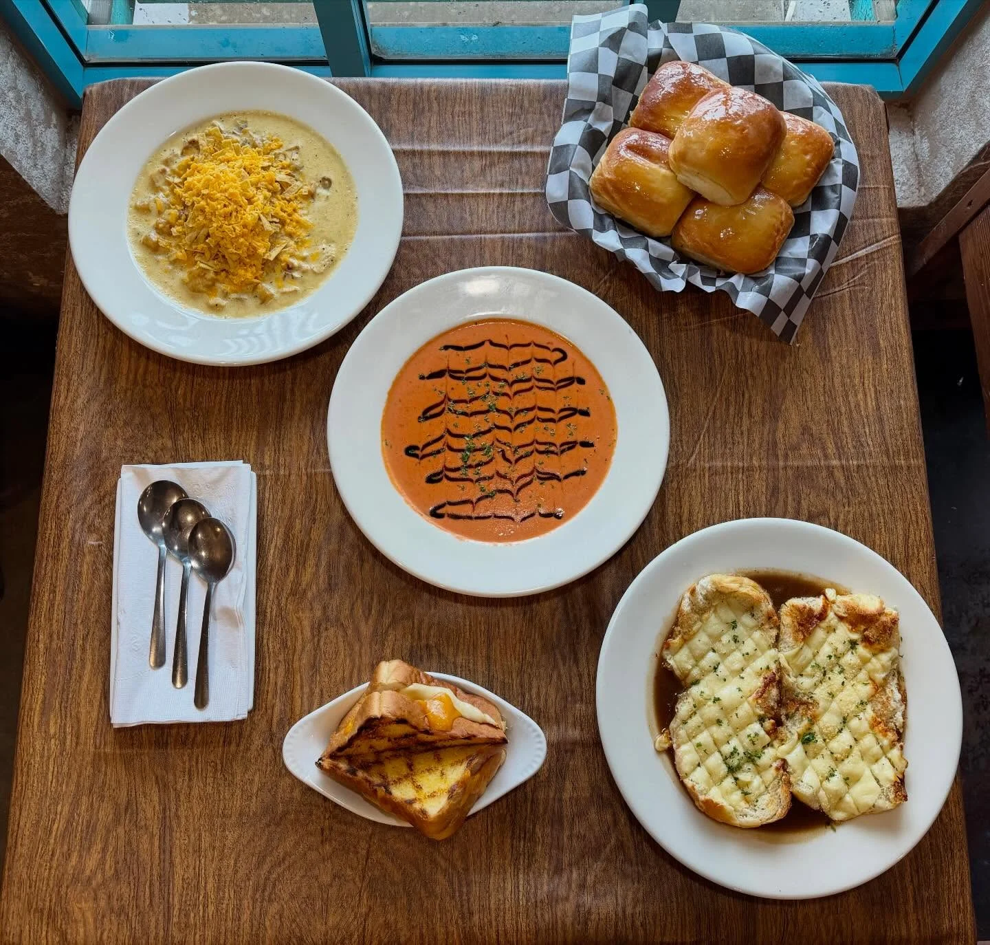 Creamy tomato basil soup with garlic bread and cheesy toast