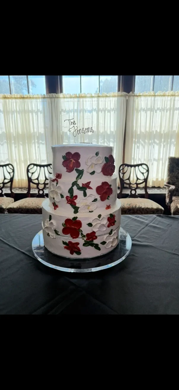 Elegant wedding cake adorned with floral decorations