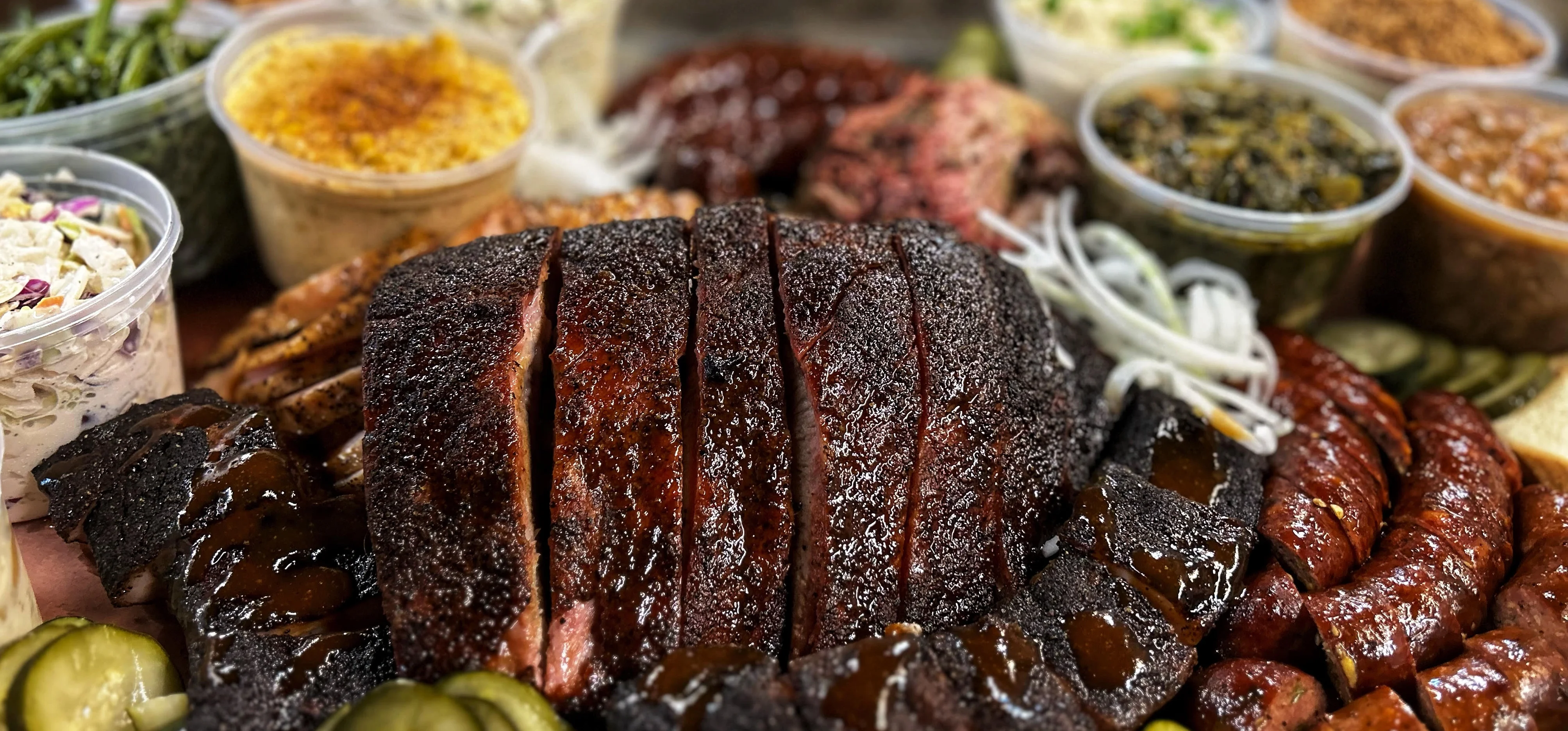 Texas-style barbecue platter with smoked meats and sides